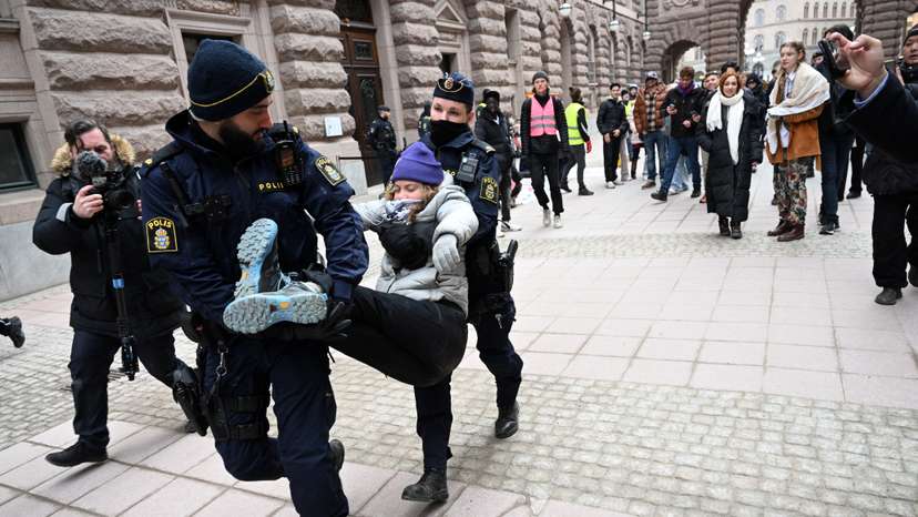 Greta Thunberg and other climate activists demonstrate outside parliament in Stockholm