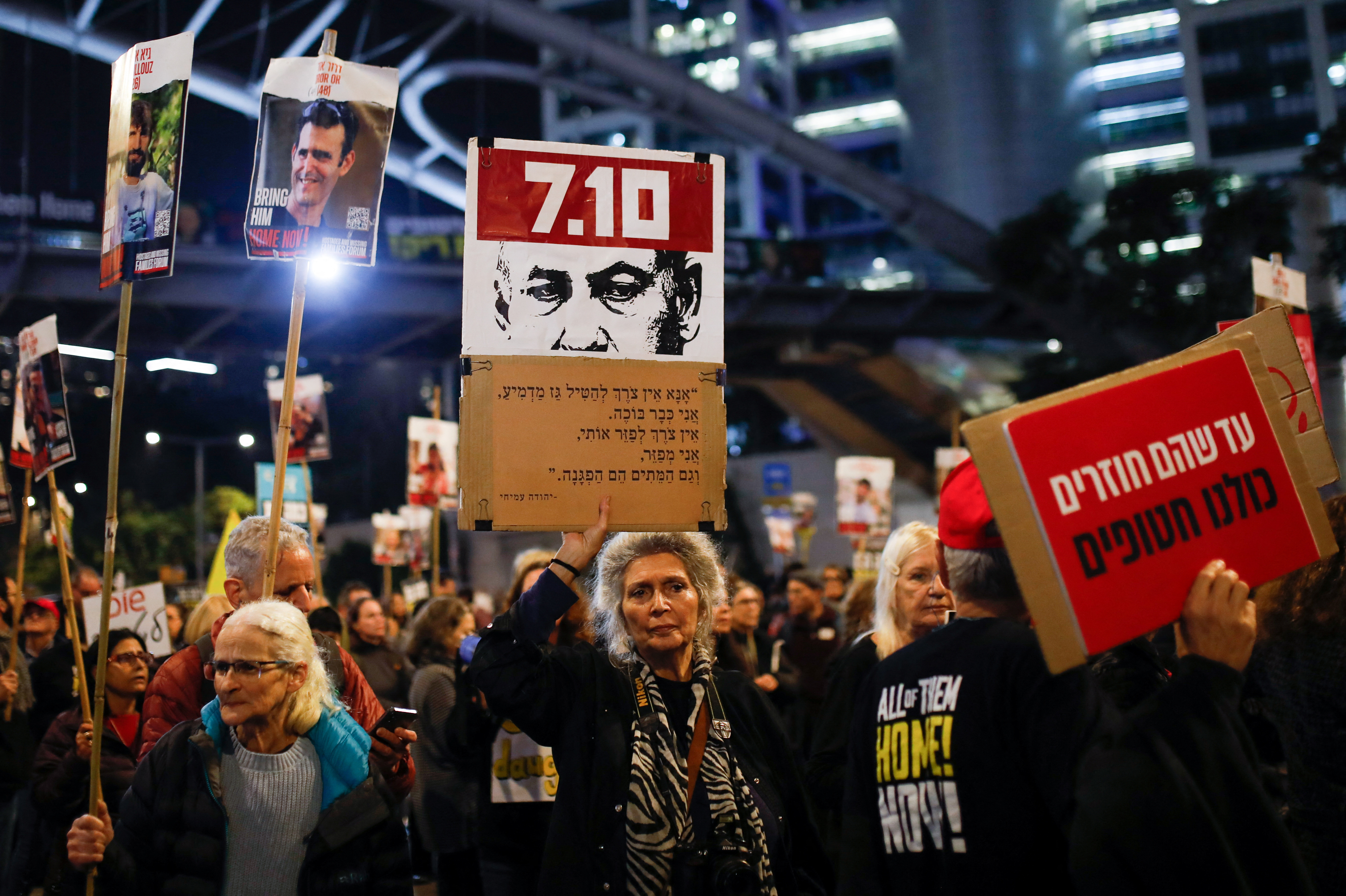 Supporters and family members of hostages protest ahead of a ceasefire between Israel and Hamas, in Tel Aviv