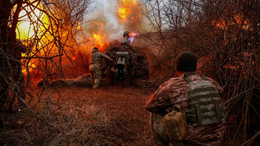 Ukrainian serviceman fire a D-30 howitzer towards Russian troops at a position in a front line in Kherson region