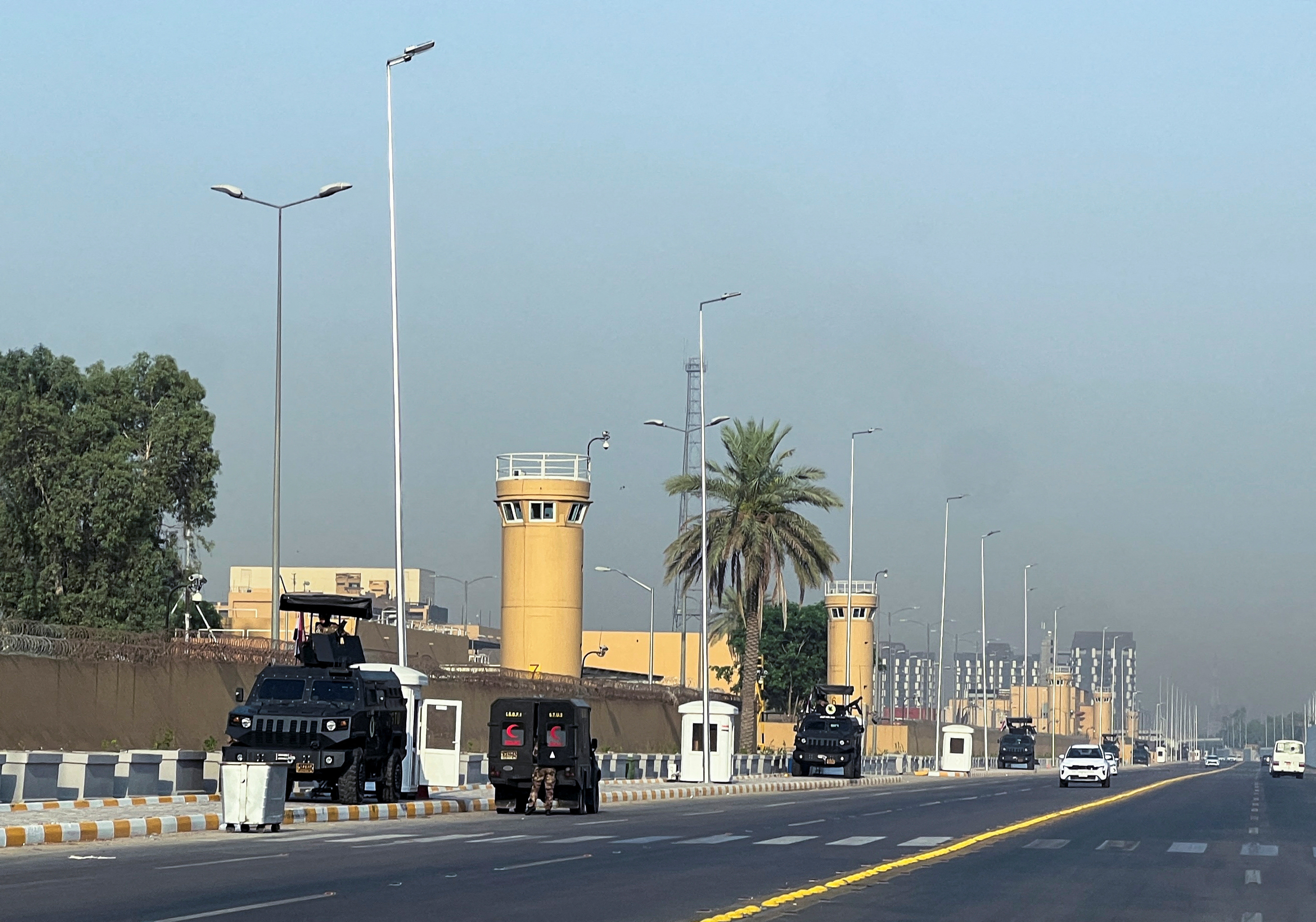Armored vehicles belonging to Iraqi security forces are stationed outside the U.S. Embassy in Baghdad’s Green Zone,