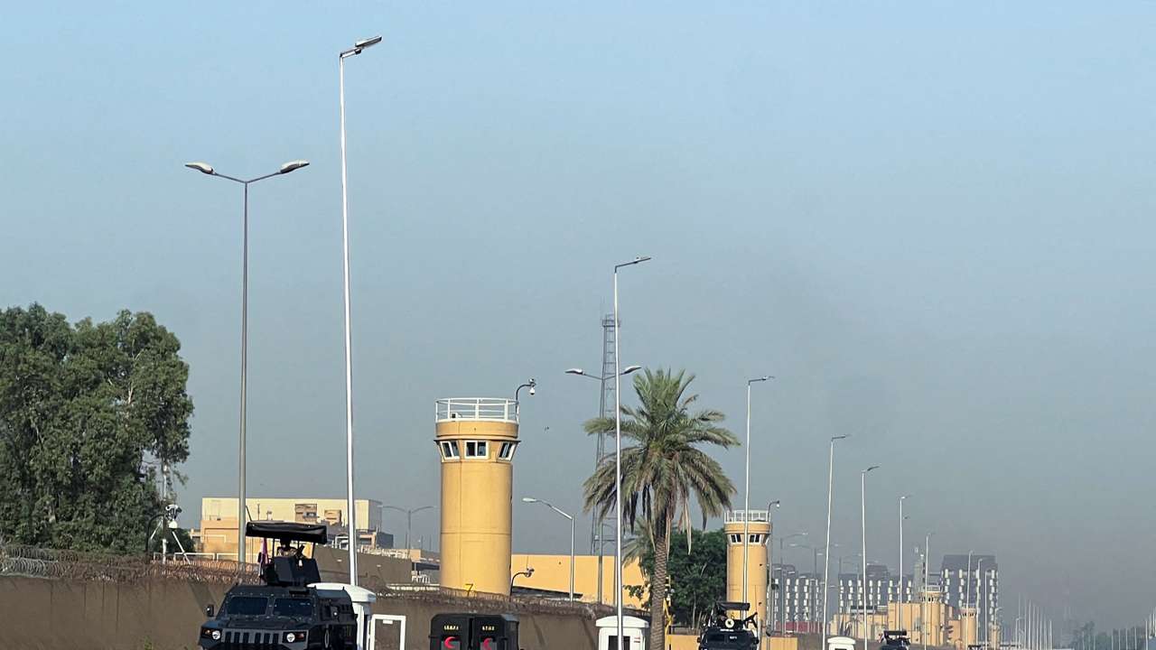 Armored vehicles belonging to Iraqi security forces are stationed outside the U.S. Embassy in Baghdad’s Green Zone,