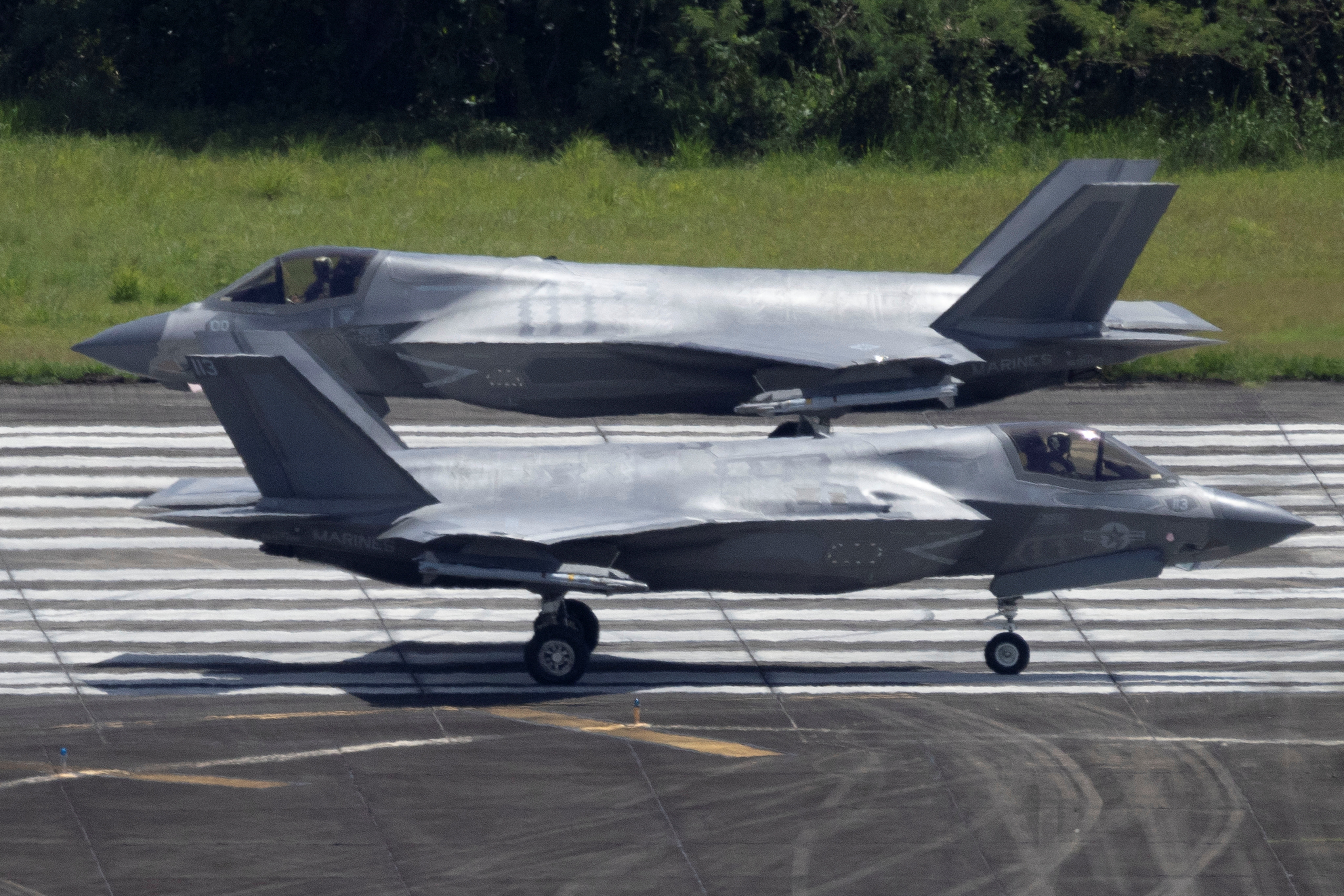 Two U.S. Marine Corps F-35 fighter jets taxi on the tarmac at the former Roosevelt Roads military base in Ceiba.