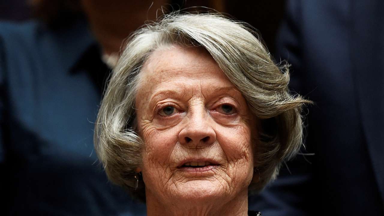 FILE PHOTO: Downton Abbey cast member Maggie Smith poses for the media at a hotel in London