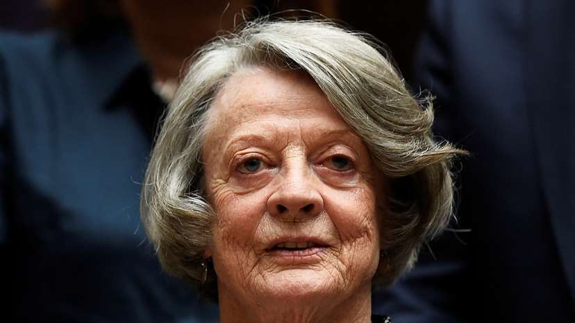 FILE PHOTO: Downton Abbey cast member Maggie Smith poses for the media at a hotel in London