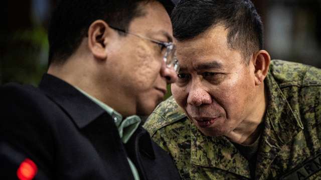 FILE PHOTO: Philippines' foreign ministry holds a joint news conference on water cannon incident in the South China Sea