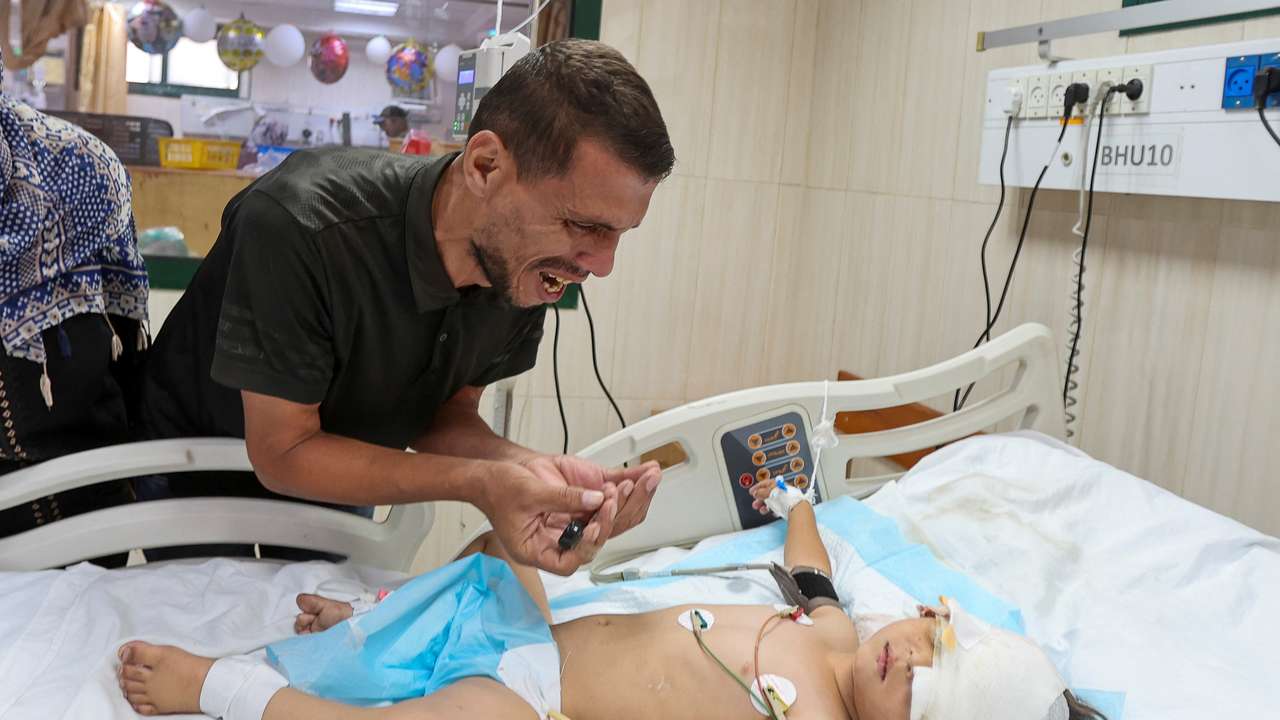 Gaza parents mourn two children, pray for wounded toddler after Israeli strike hit them queuing for supplements near a medical center