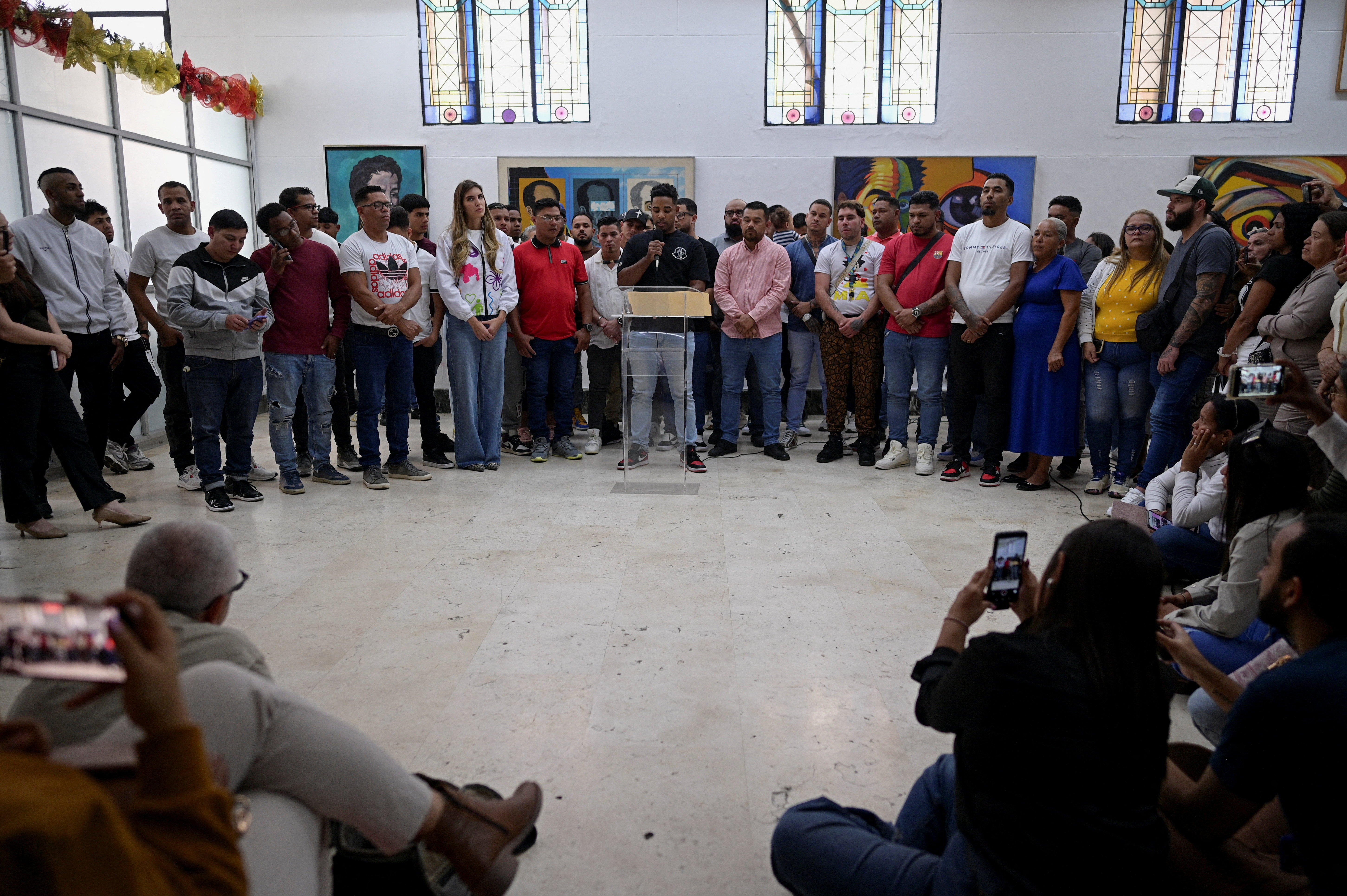 Venezuelans who where imprisoned in El Salvador's CECOT mega-prison give statements to the press, in Caracas