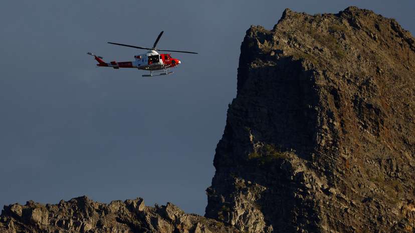 A rescue helicopter searches for a young British man who disappeared in the Masca ravine, on the island of Tenerife