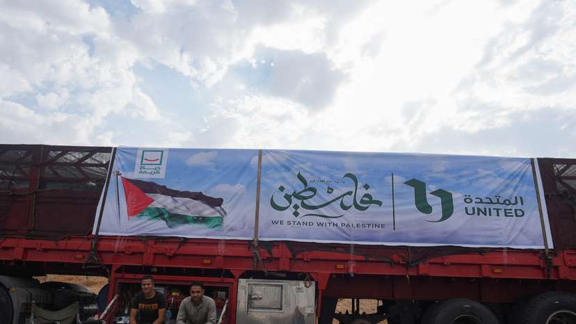 Trucks carrying humanitarian aid to Palestinians, wait on the desert road (Cairo - Ismailia) on their way to the Rafah border crossing to enter Gaza
