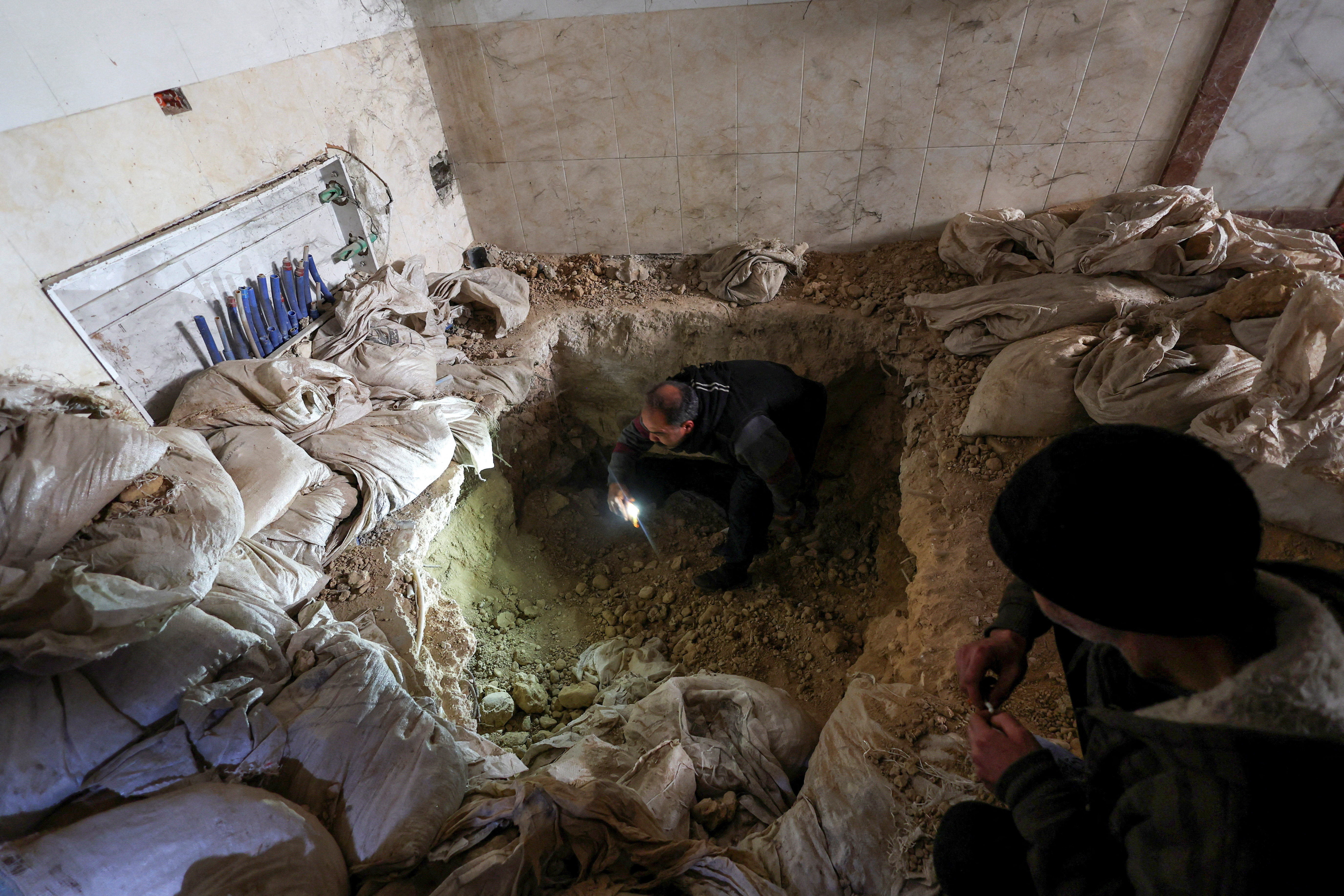 Tadamon district of Damascus is littered with bones after what residents and rights groups described as years of killings there under the rule of Syria's Bashar al-Assad