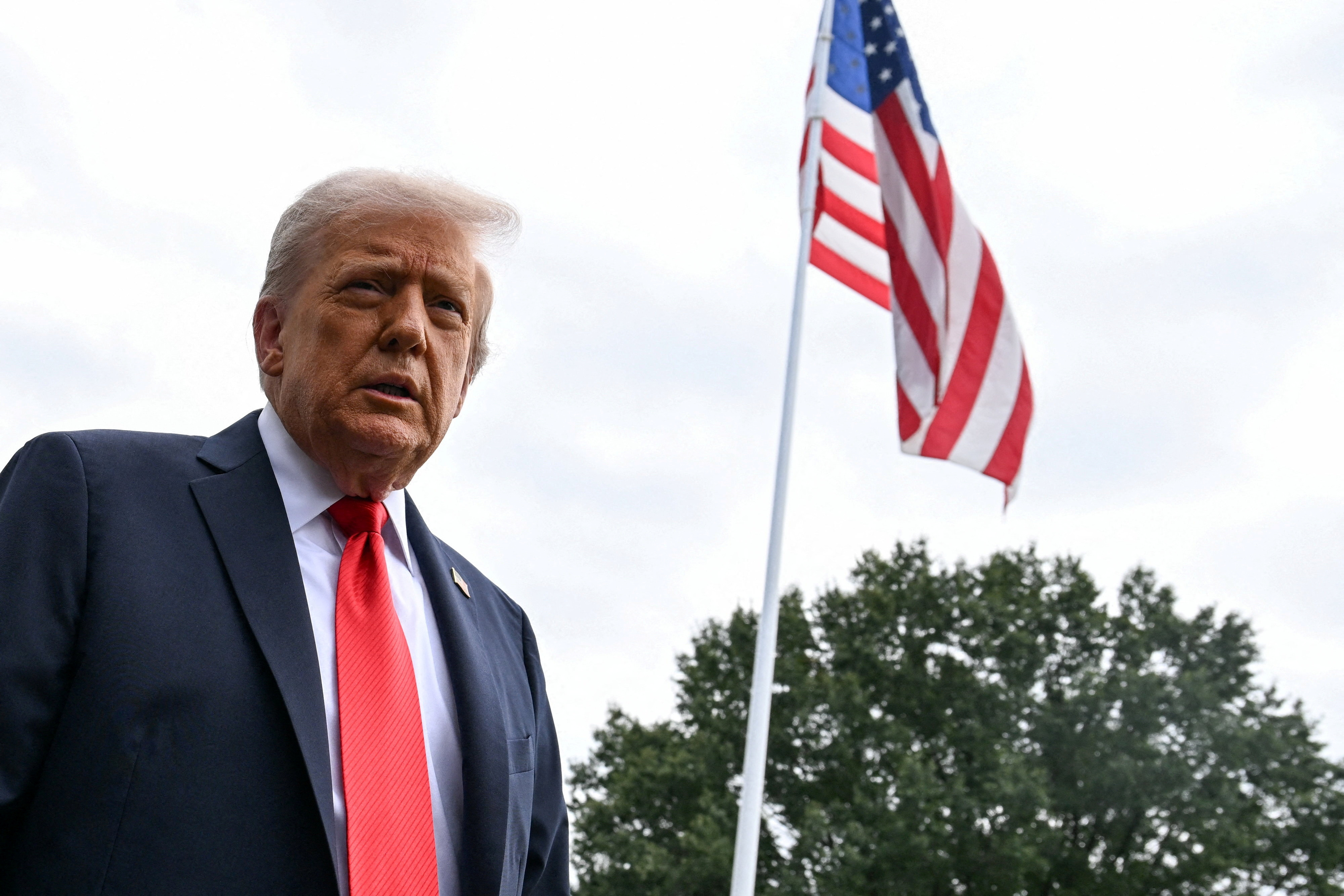 FILE PHOTO: U.S. President Donald Trump talks to the press on the South Lawn of the White House in Washington