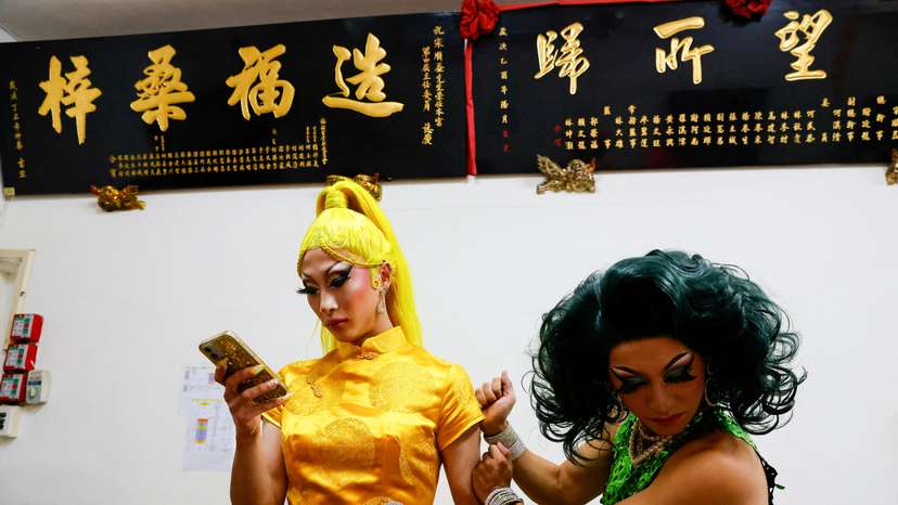 FILE PHOTO: Nymphia Wind and another Taiwanese drag queen prepare before their performance at a local temple in Taipei