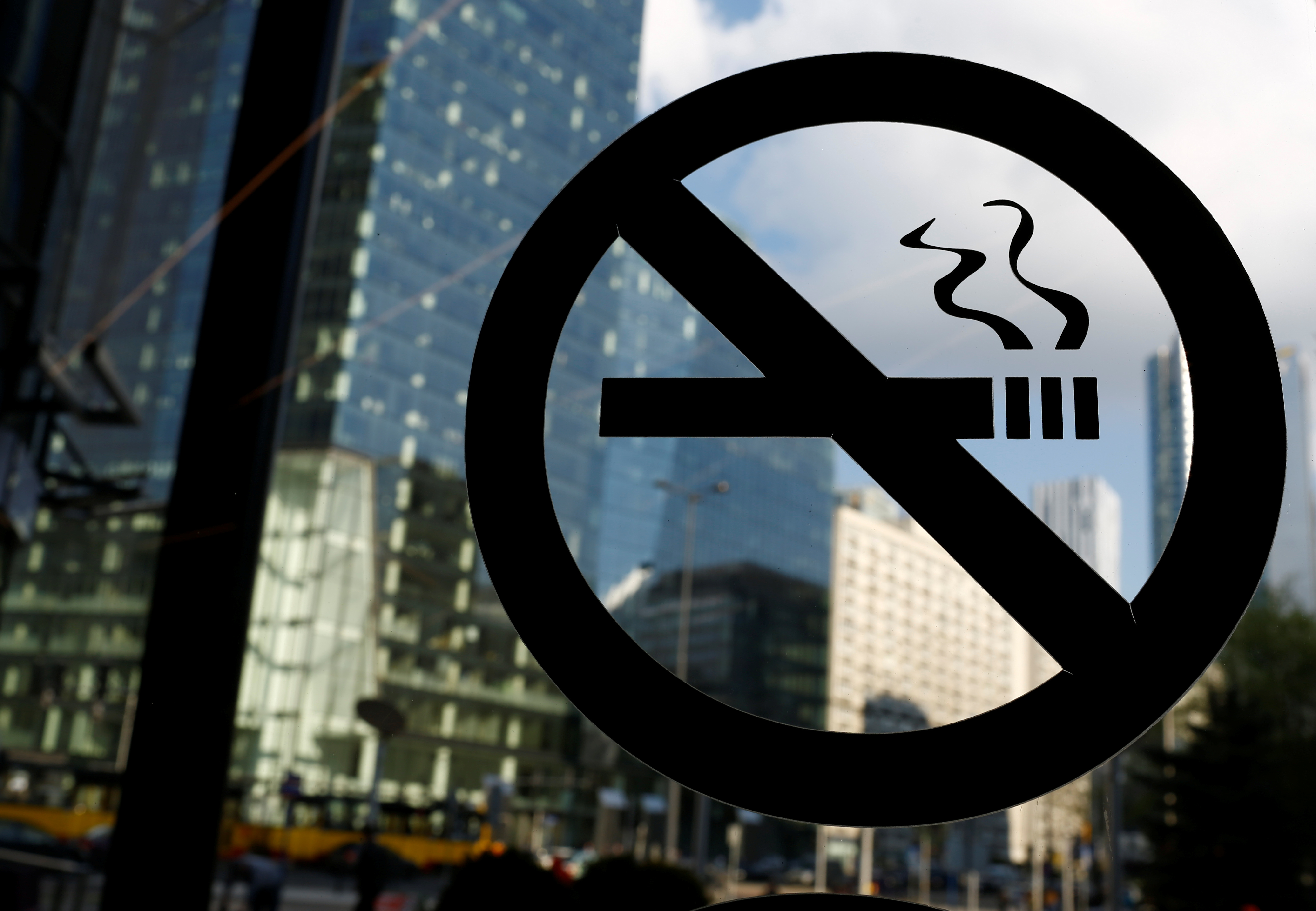 No smoking sign is placed on the office building window in the centre of Warsaw