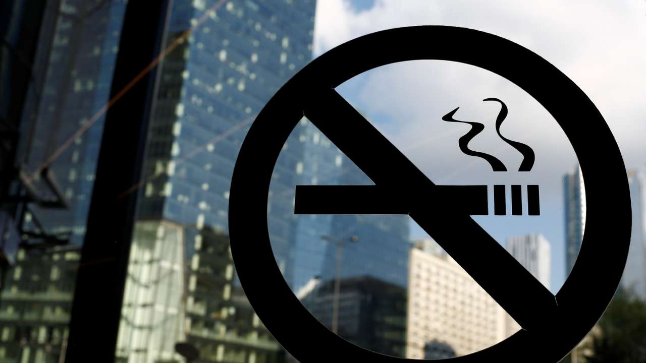 No smoking sign is placed on the office building window in the centre of Warsaw
