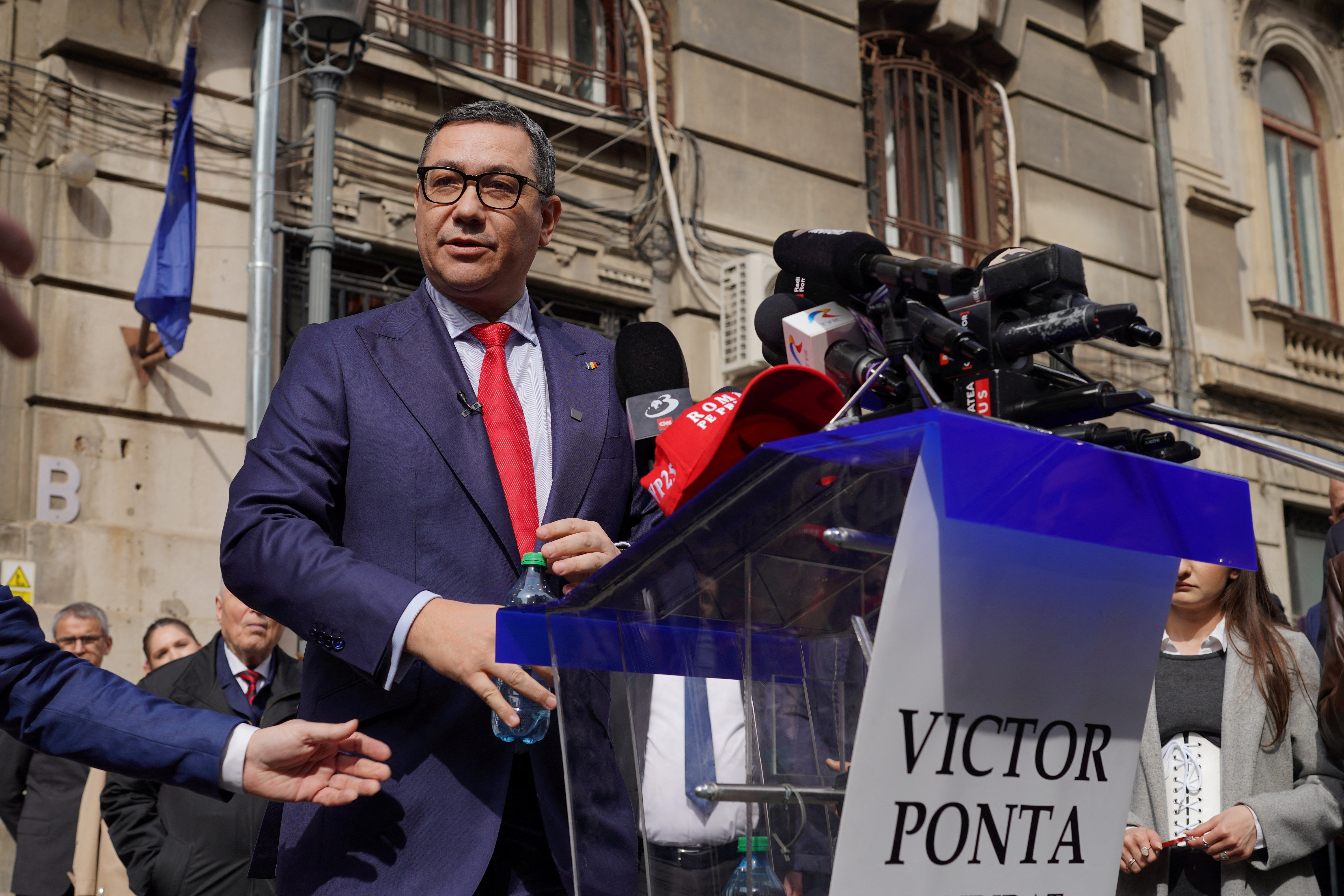 Victor Ponta talks to media after submitting his candidacy for presidential elections