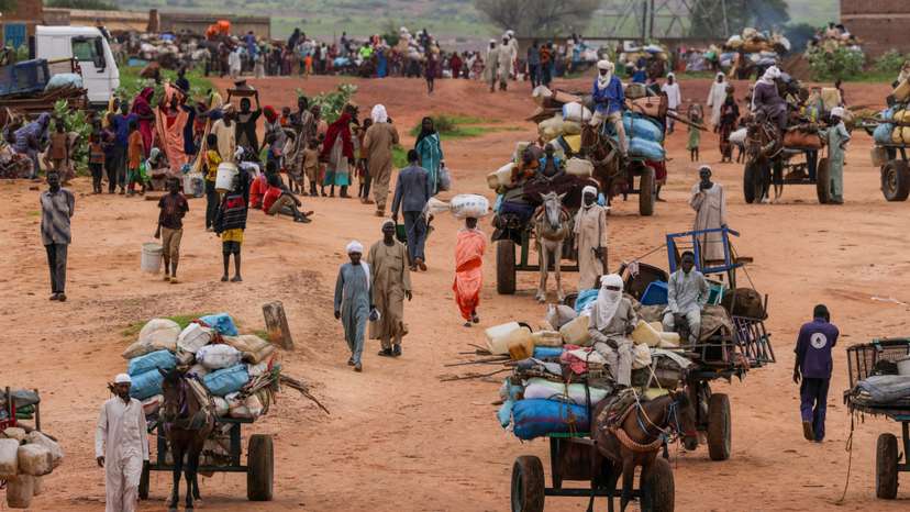 FILE PHOTO: People fleeing the violence in West Darfur