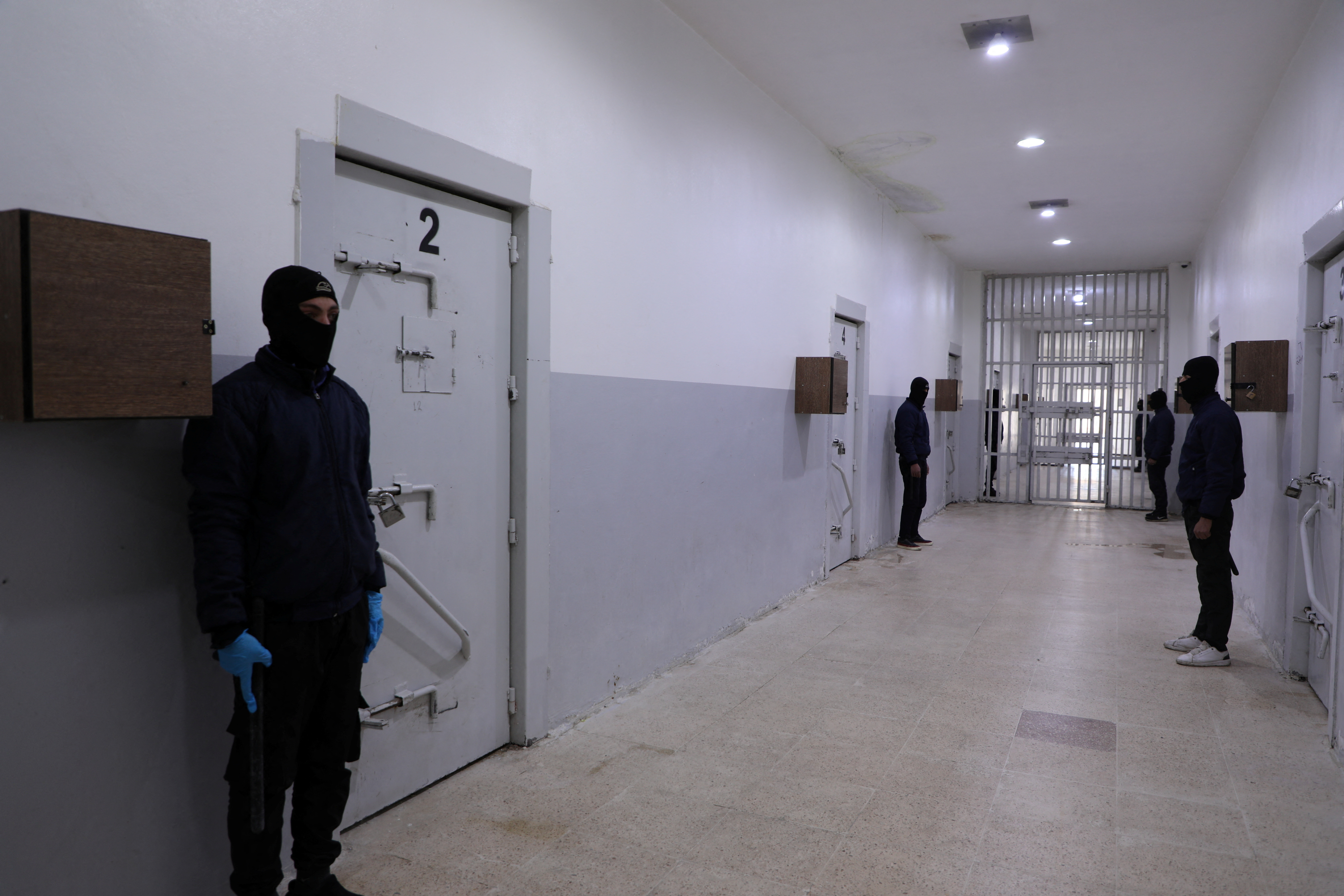 Prison guards secure the al-Sina'a prison in Hasakah