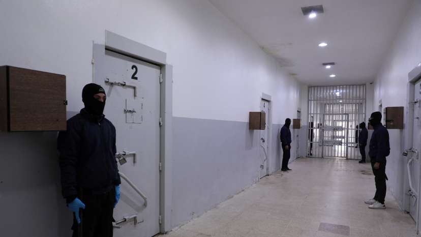Prison guards secure the al-Sina'a prison in Hasakah