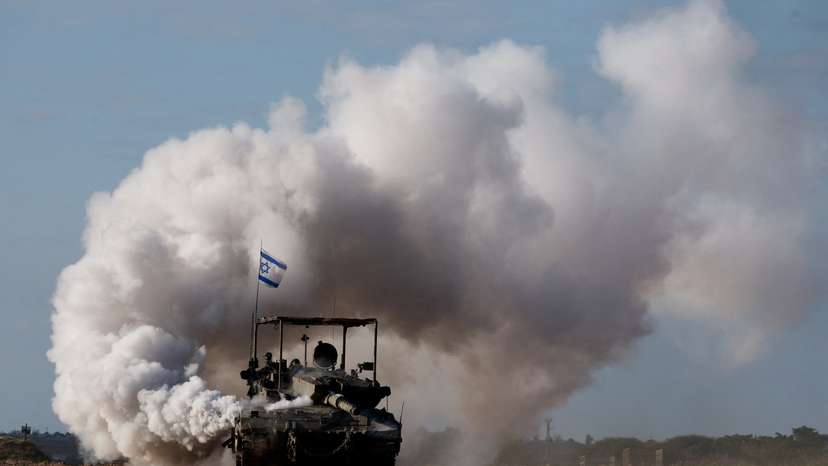An Israeli tank manoeuvres near the Israel-Gaza border