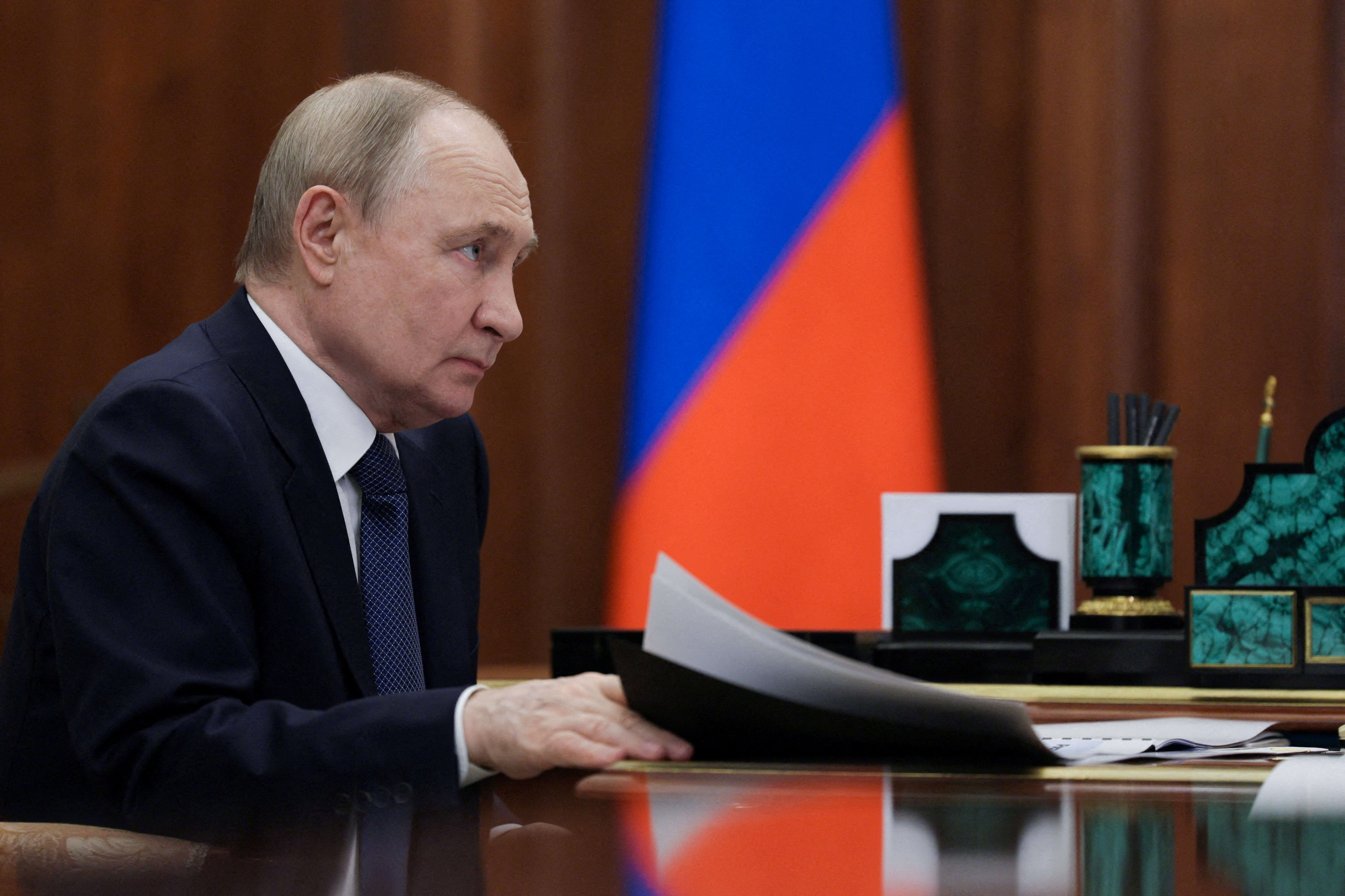 FILE PHOTO: Russian President Vladimir Putin meets with Ulyanovsk Region Governor Alexei Russkikh in Moscow