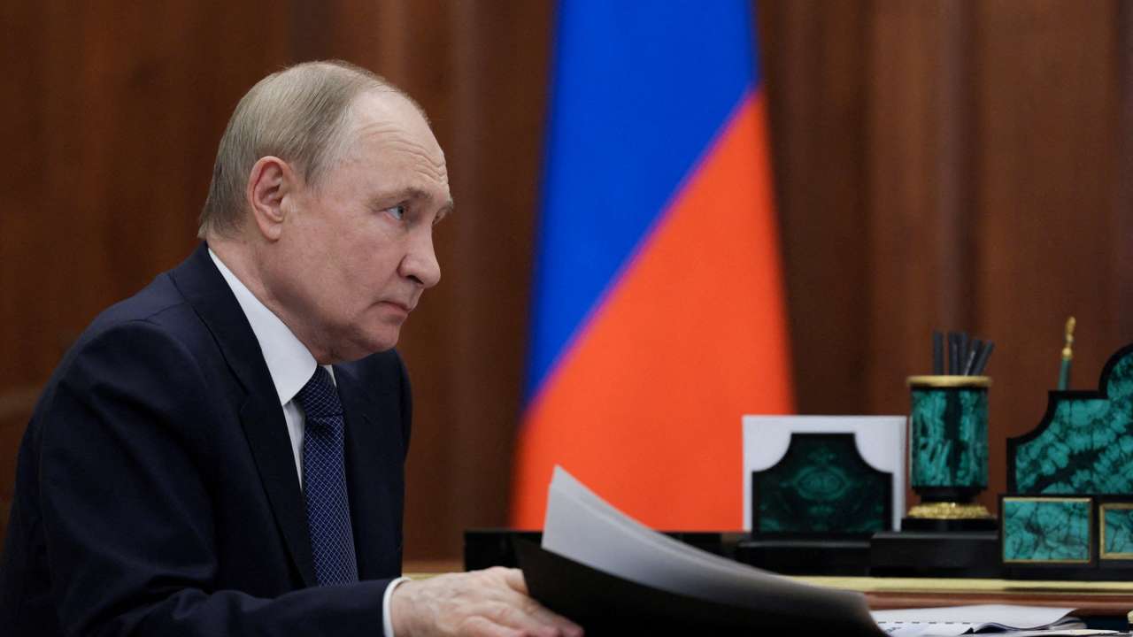 FILE PHOTO: Russian President Vladimir Putin meets with Ulyanovsk Region Governor Alexei Russkikh in Moscow