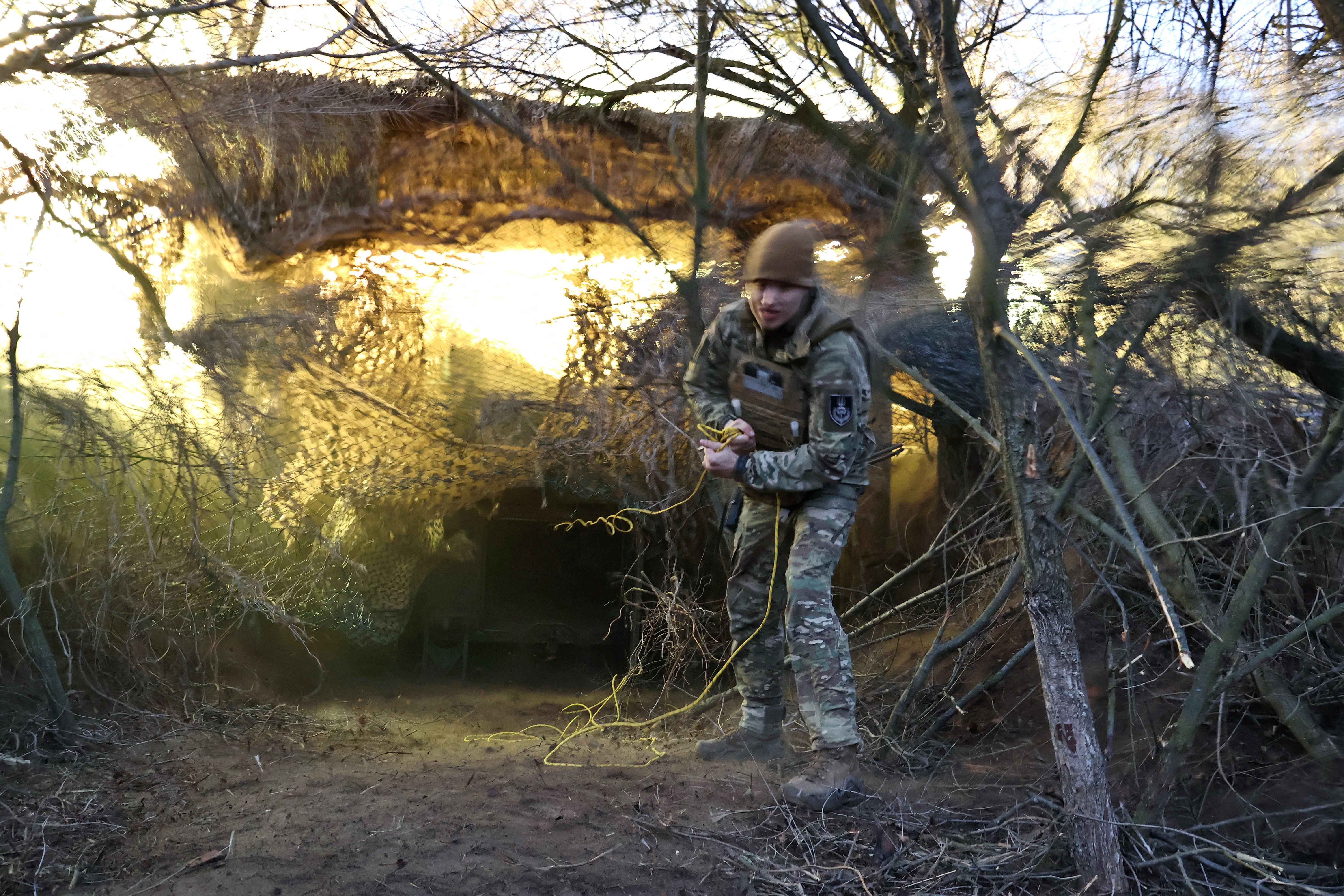 Ukrainian service members fire an M109 self-propelled howitzer towards Russian troops in Zaporizhzhia region