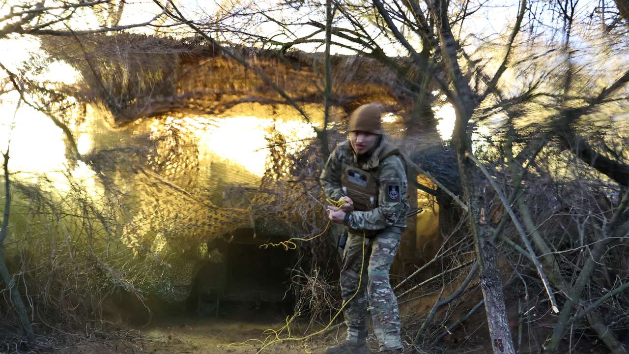 Ukrainian service members fire an M109 self-propelled howitzer towards Russian troops in Zaporizhzhia region