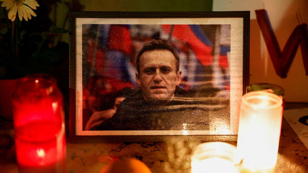 FILE PHOTO: FILE PHOTO: People attend a vigil following the death of Russian opposition leader Alexei Navalny, in Paris