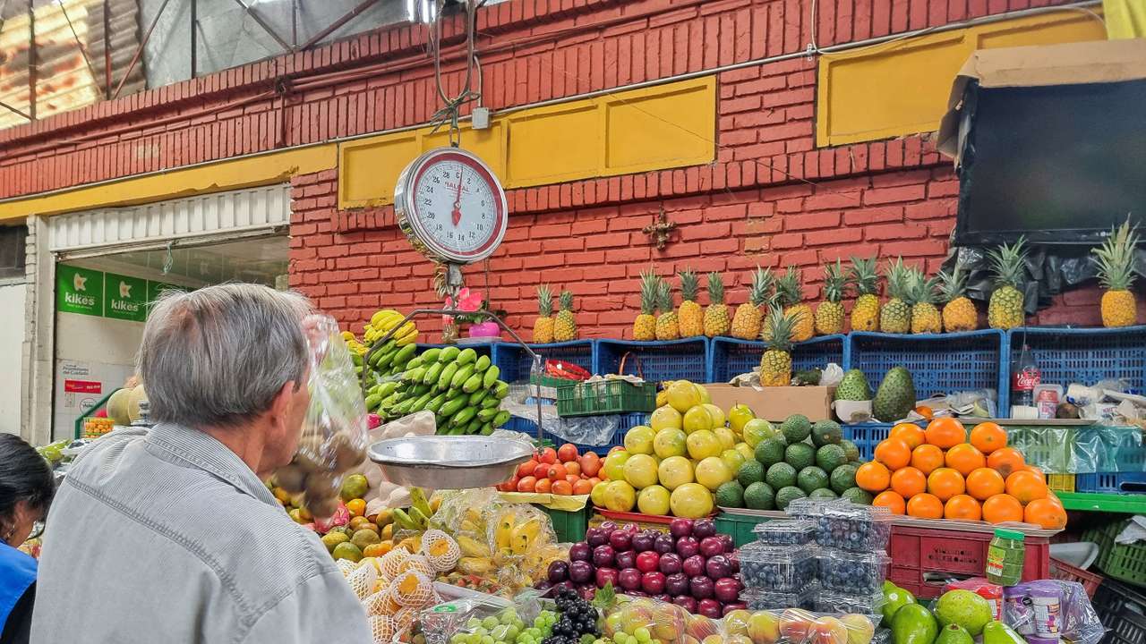 FILE PHOTO: A person sells food in a market square in Bogota