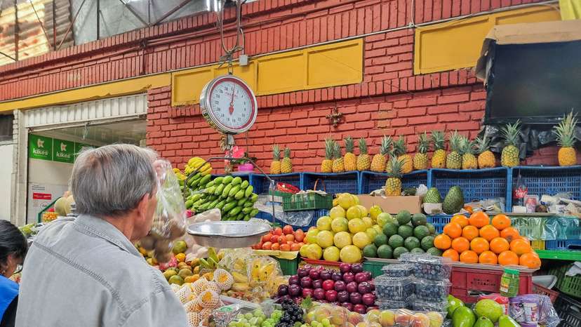 FILE PHOTO: A person sells food in a market square in Bogota