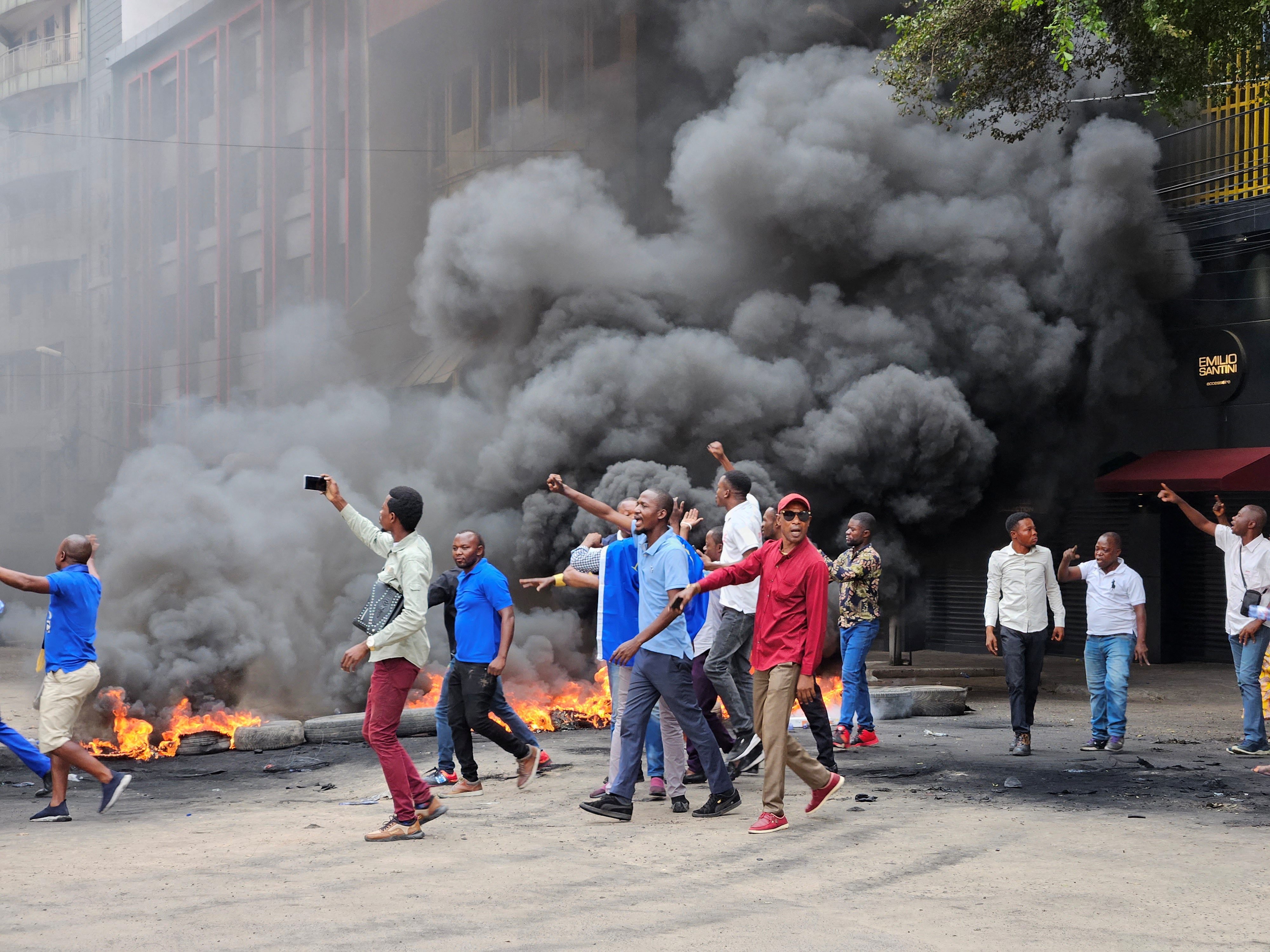 Supporters of the Movement for the Liberation of the Congo (MLC) party contest the results of the legislative elections in Kinshasa