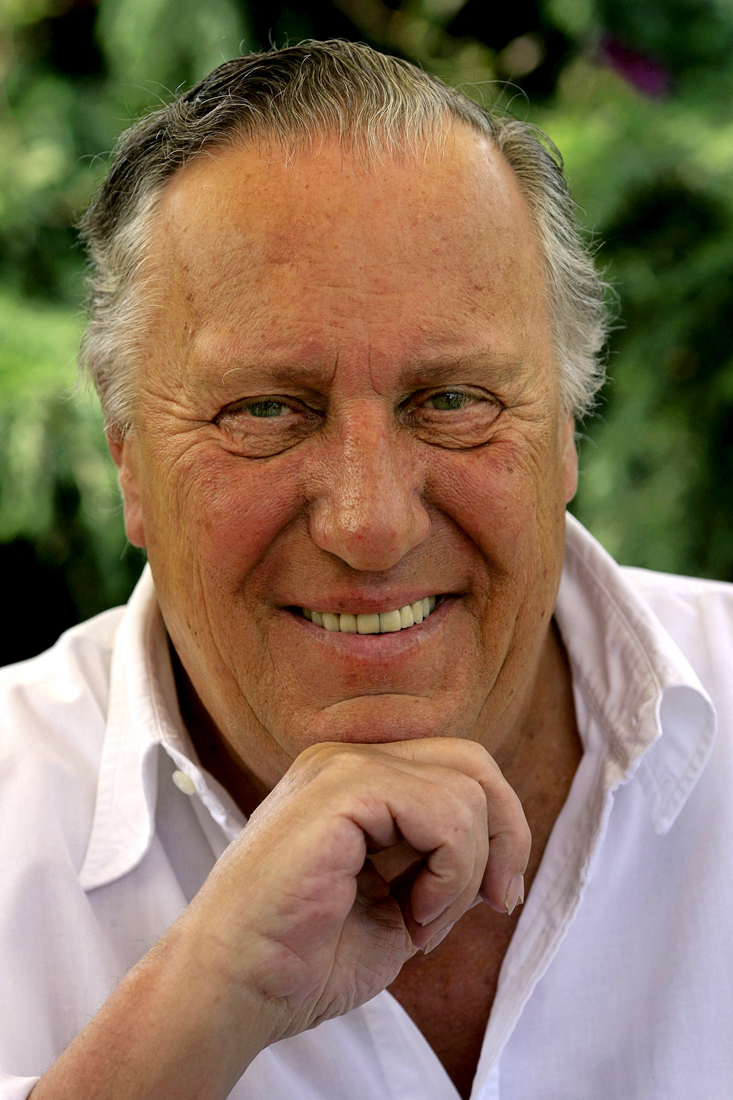 FILE PHOTO: British novelist Frederick Forsyth smiles during an interview with Reuters at his home near Hertford