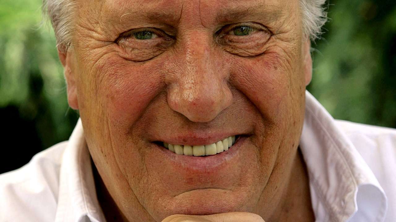 FILE PHOTO: British novelist Frederick Forsyth smiles during an interview with Reuters at his home near Hertford