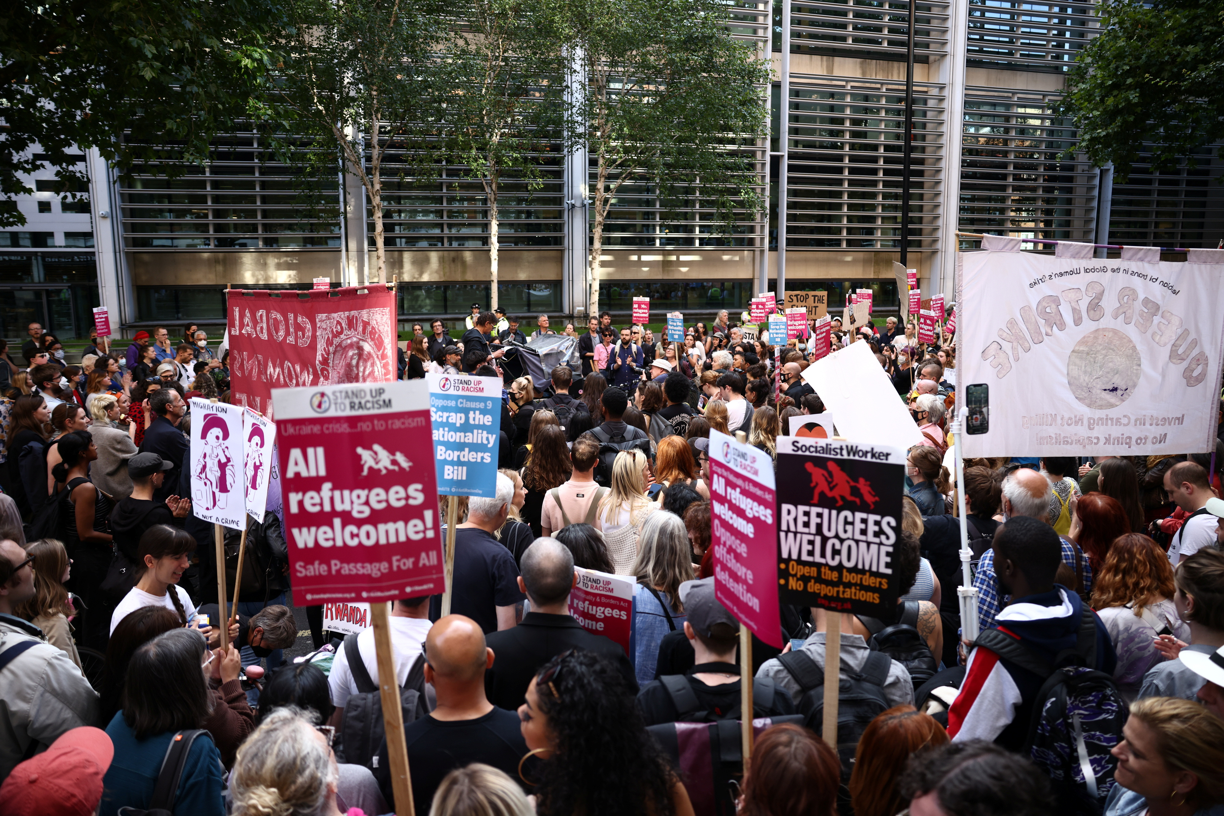 Protestors demonstrate outside the Home Office building against the British Governments plans to deport asylum seekers to Rwanda