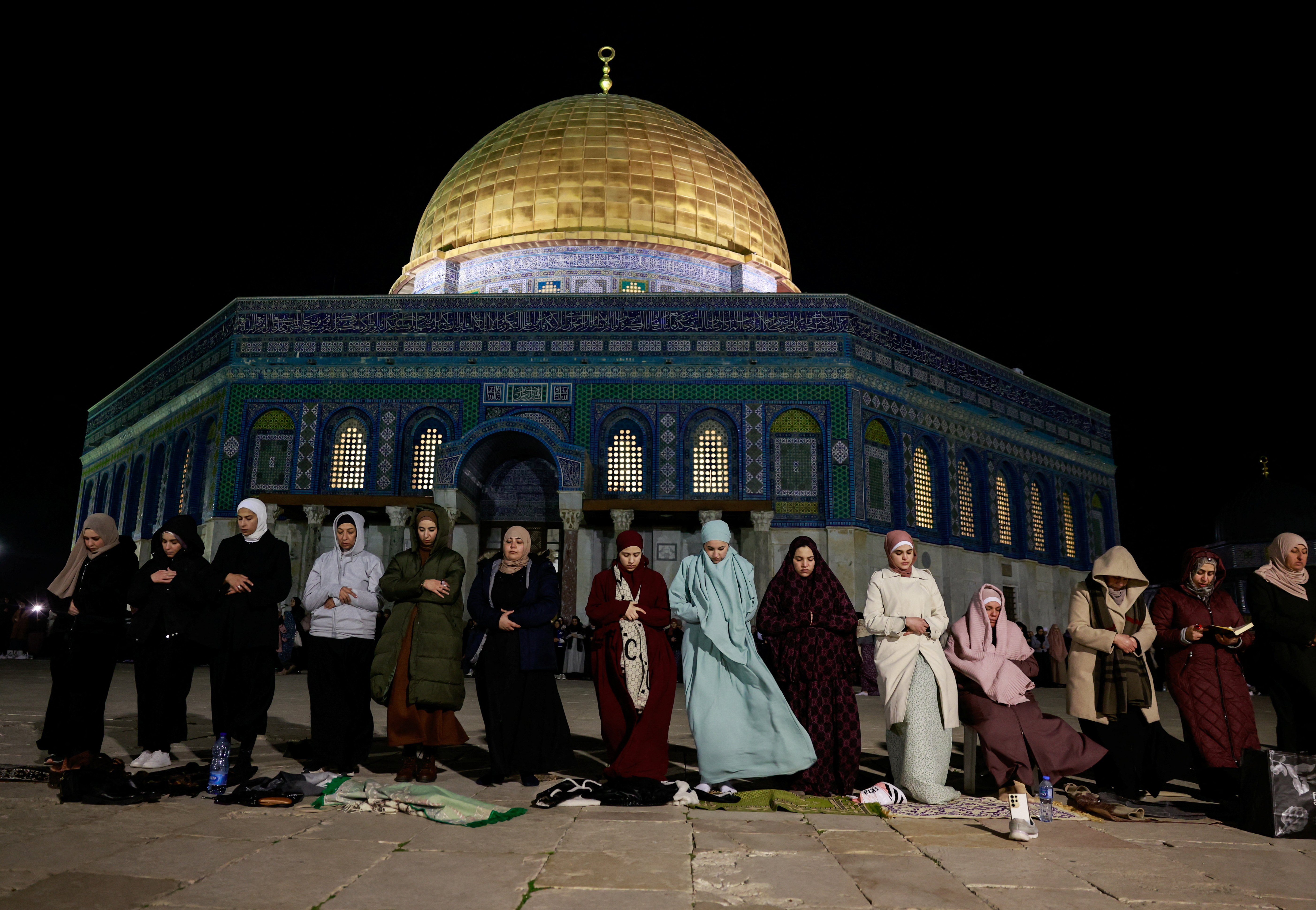 Muslim worshippers take part in the evening 'Tarawih' prayers during the holy month of Ramadan, in Jerusalem’s Old City