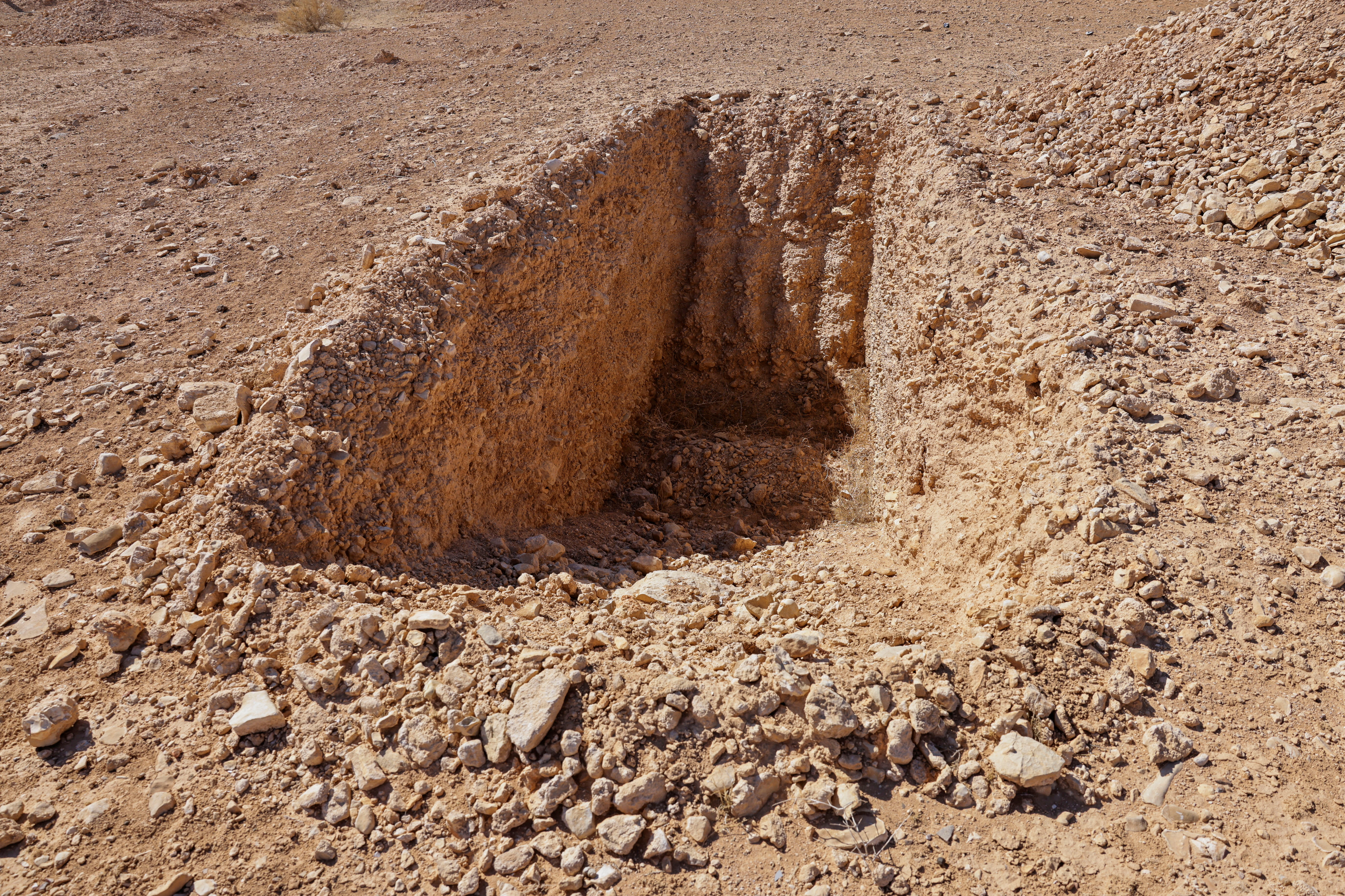 FILE PHOTO: A detail of what one witness told Reuters was an incomplete trench dug to take bodies in this mass grave site in the desert near the eastern Syrian town of Dhumair