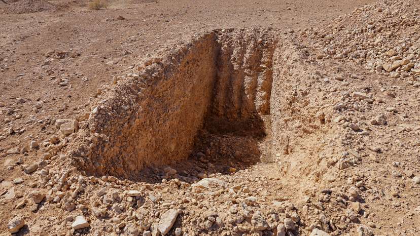 FILE PHOTO: A detail of what one witness told Reuters was an incomplete trench dug to take bodies in this mass grave site in the desert near the eastern Syrian town of Dhumair