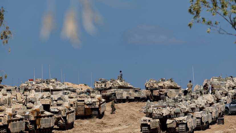 Israeli soldiers, tanks and armoured personnel carriers (APCs) near the Israel-Gaza border