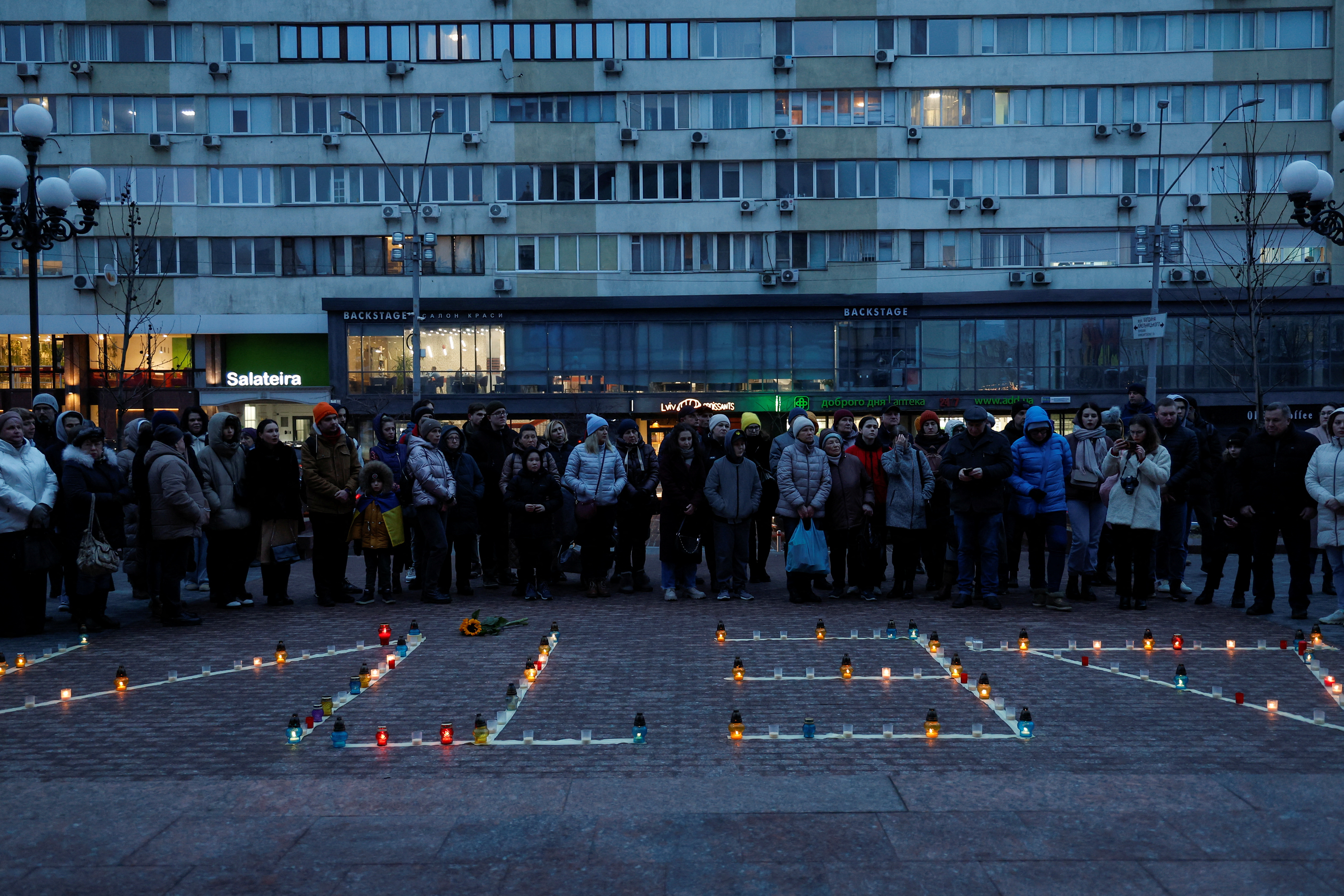 People commemorate victims of Russian air strike on Mariupol's Drama Theatre, in Kyiv