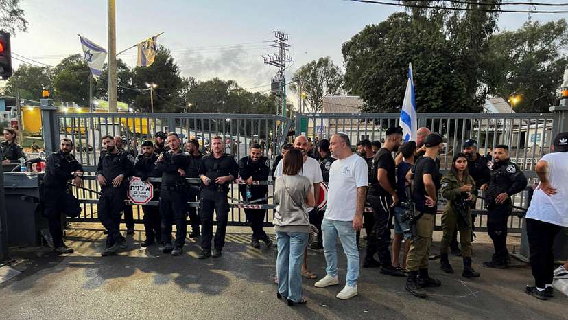 FILE PHOTO: Protesters gather at a military base, after Israeli military police opened an investigation into the suspected abuse of a Palestinian detainee, in Netanya