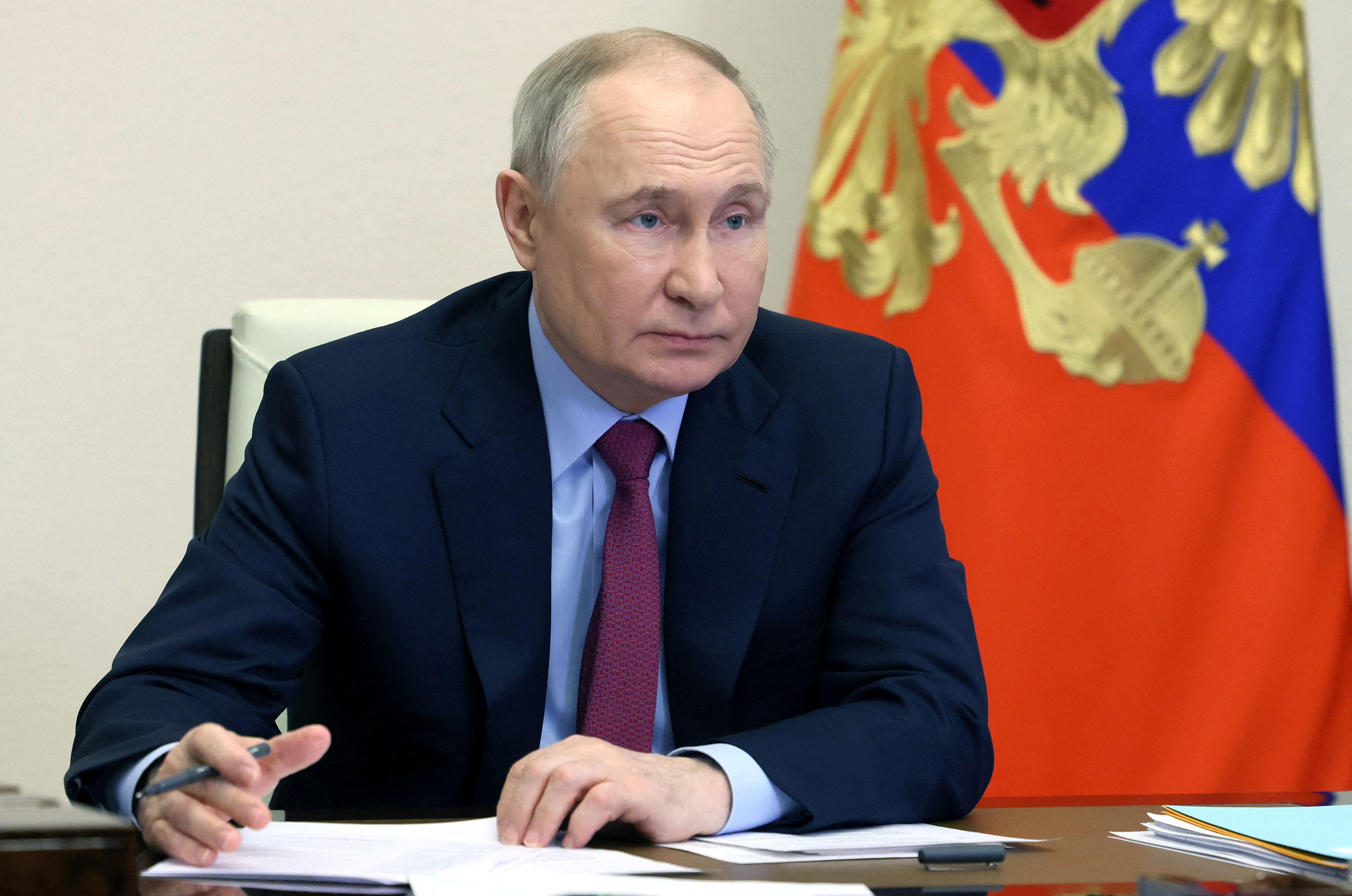 Russian President Putin takes part in a ceremony outside Moscow