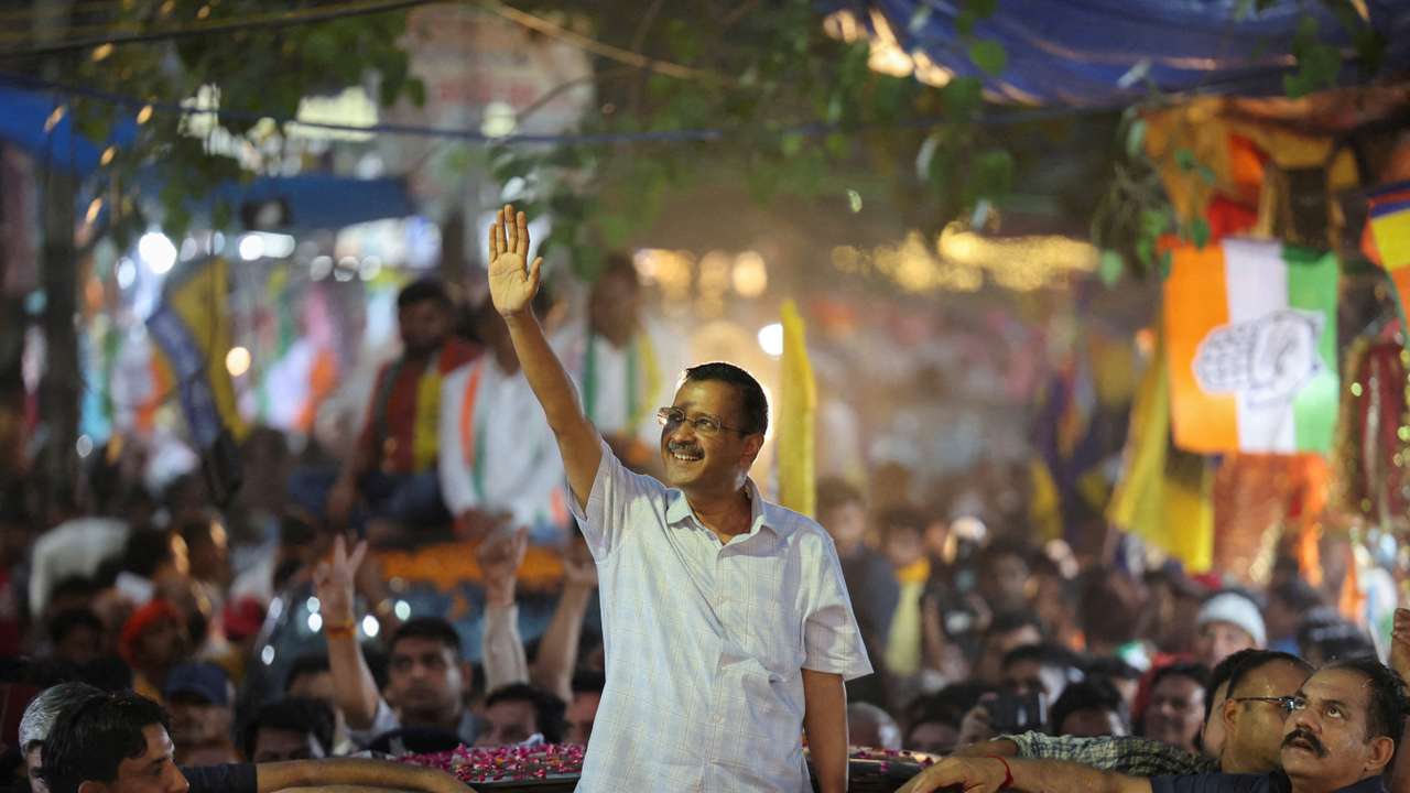 FILE PHOTO: People gather as Delhi's Chief Minister Arvind Kejriwal attends a roadshow, in New Delhi