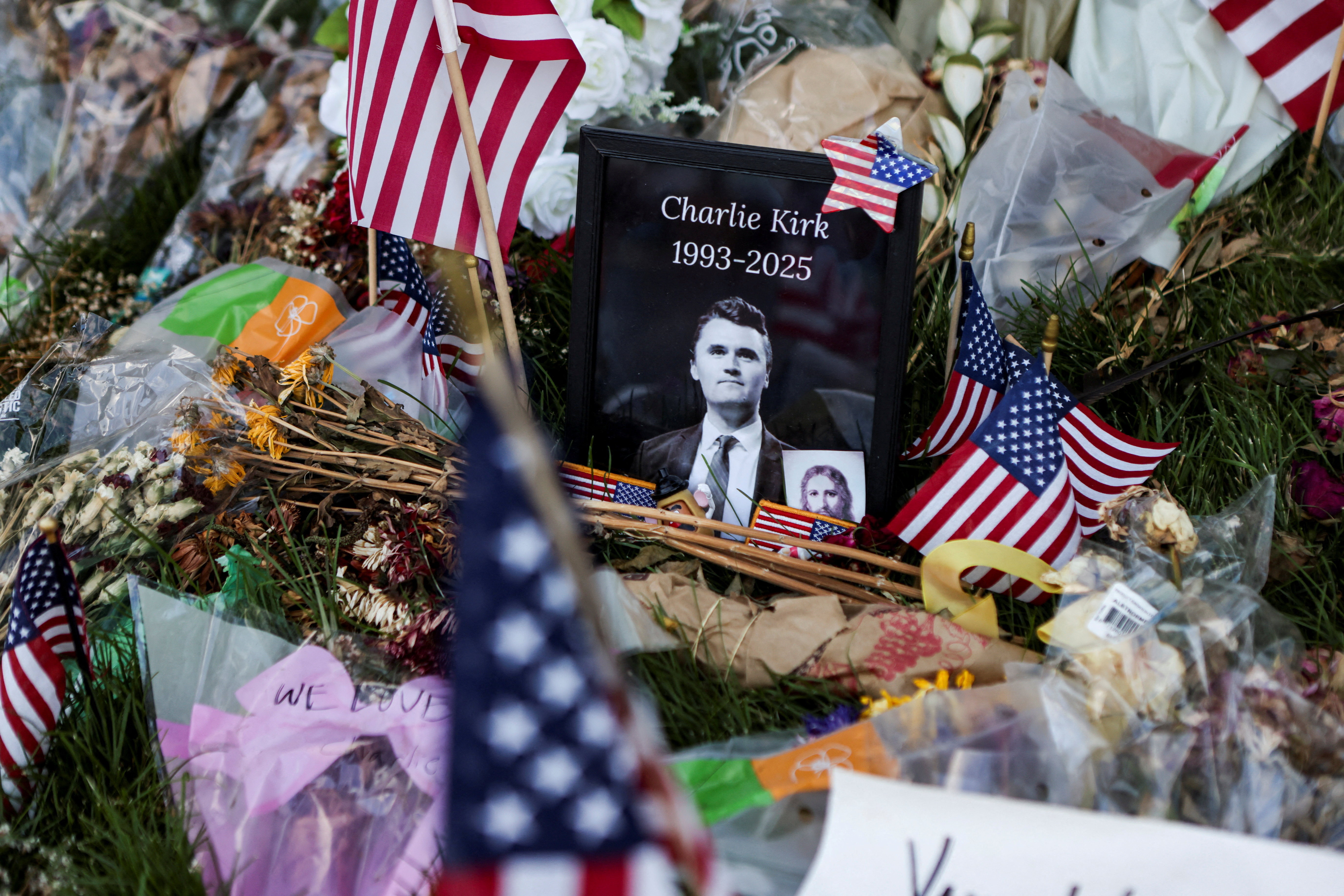 FILE PHOTO: People pay their respects at a memorial for slain conservative commentator Charlie Kirk, at Utah Valley University