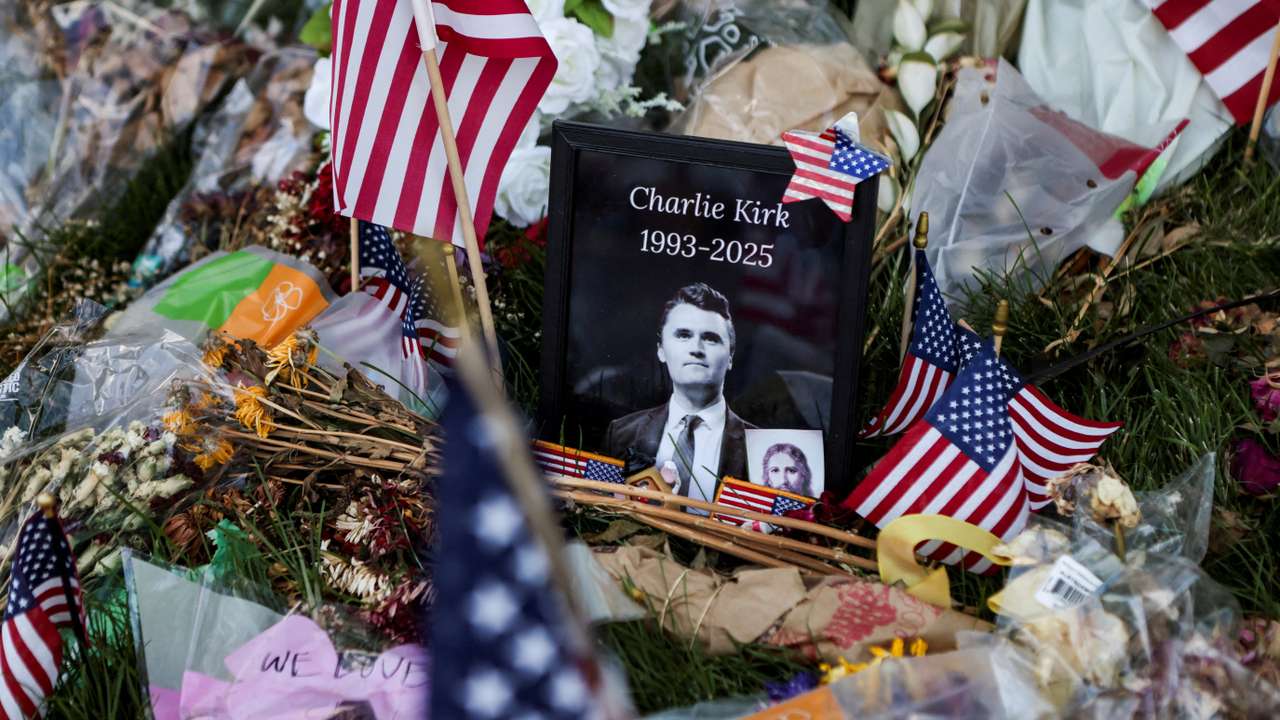 FILE PHOTO: People pay their respects at a memorial for slain conservative commentator Charlie Kirk, at Utah Valley University