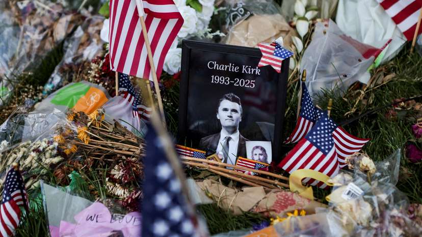 FILE PHOTO: People pay their respects at a memorial for slain conservative commentator Charlie Kirk, at Utah Valley University