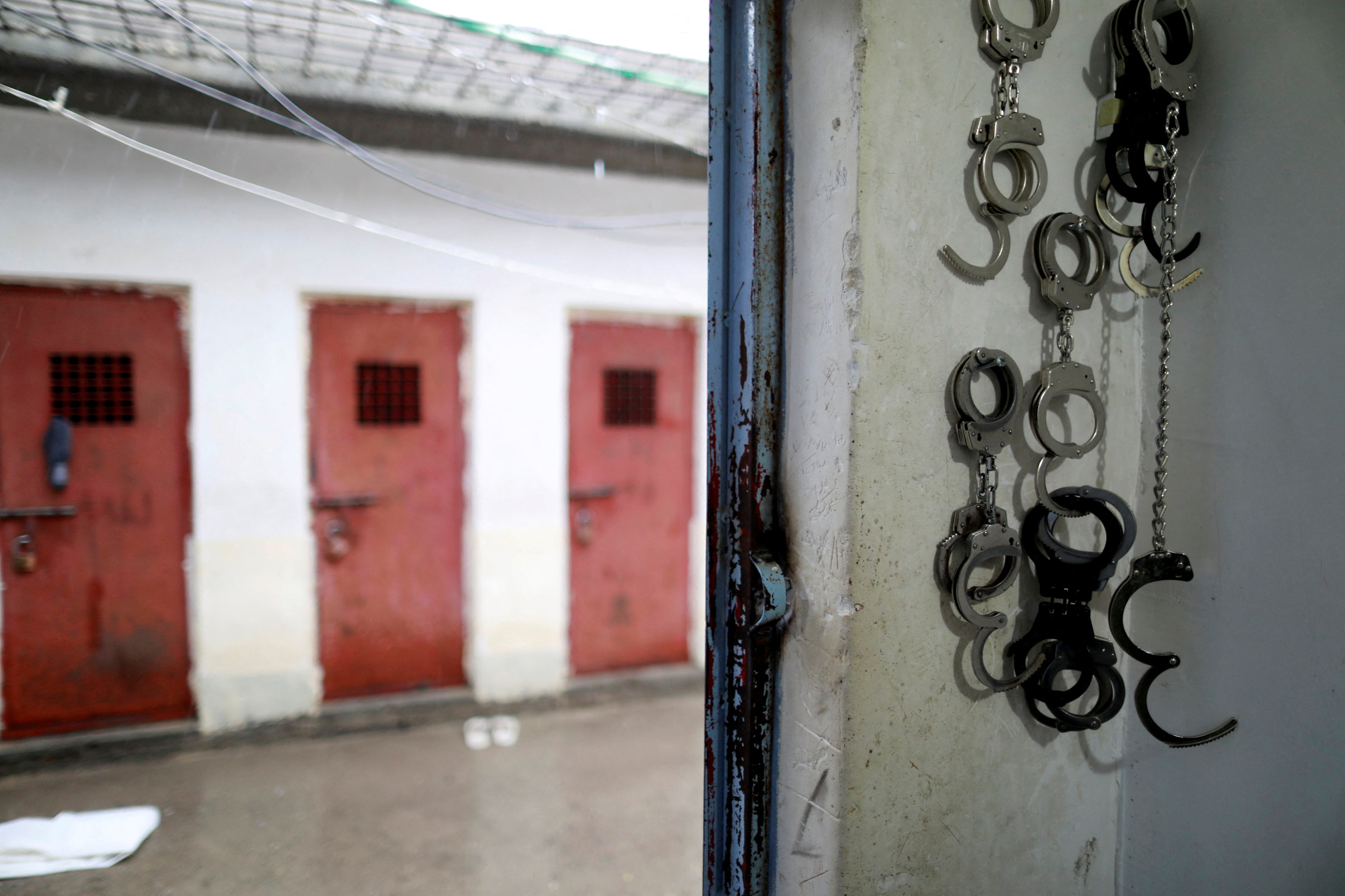FILE PHOTO: Cuffs are seen in front of cells housing