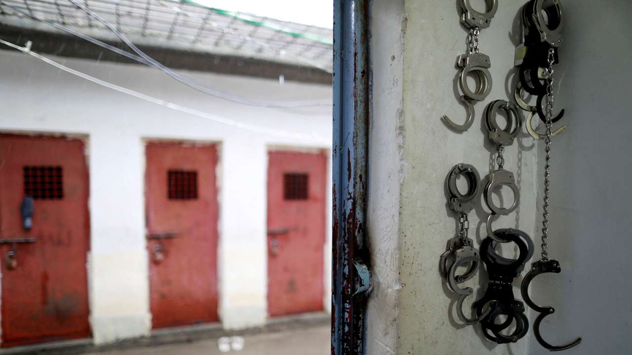 FILE PHOTO: Cuffs are seen in front of cells housing