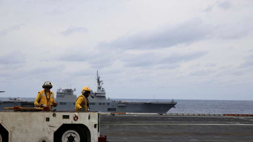 United States Seventh Fleet conducts joint exercises aboard USS Carl Vinson flanked by Japan's helicopter carrier Hyuga, in the Pacific Ocean