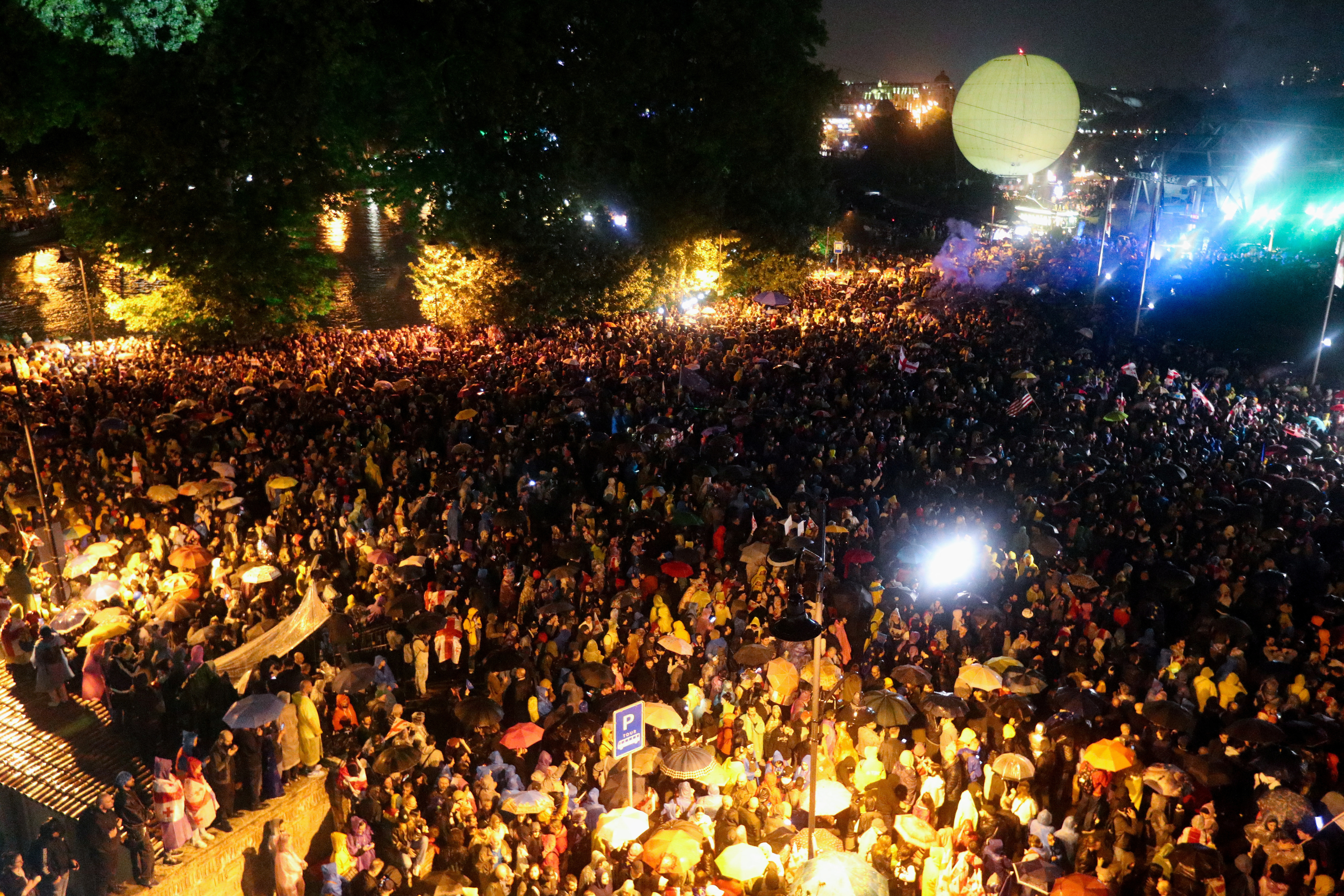 Demonstrators hold a rally to protest against a bill on "foreign agents" in Tbilisi