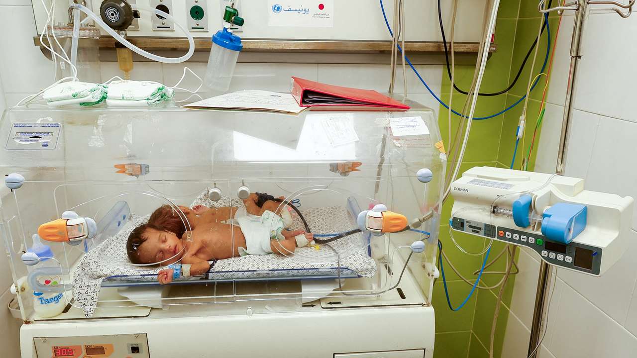 FILE PHOTO: Premature baby evacuated from Al Shifa Hospital lies in an incubator in Rafah